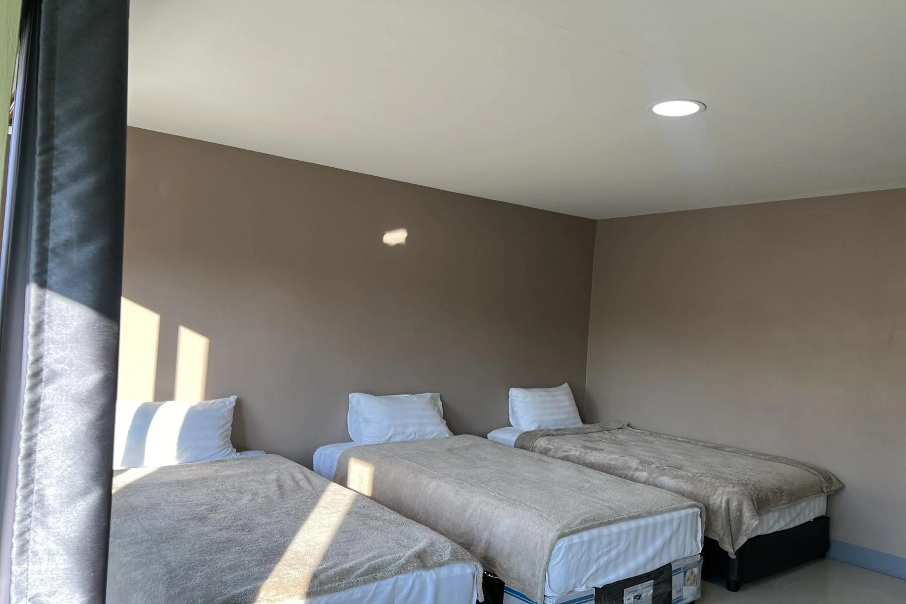 Bed in V Tharm Hotel