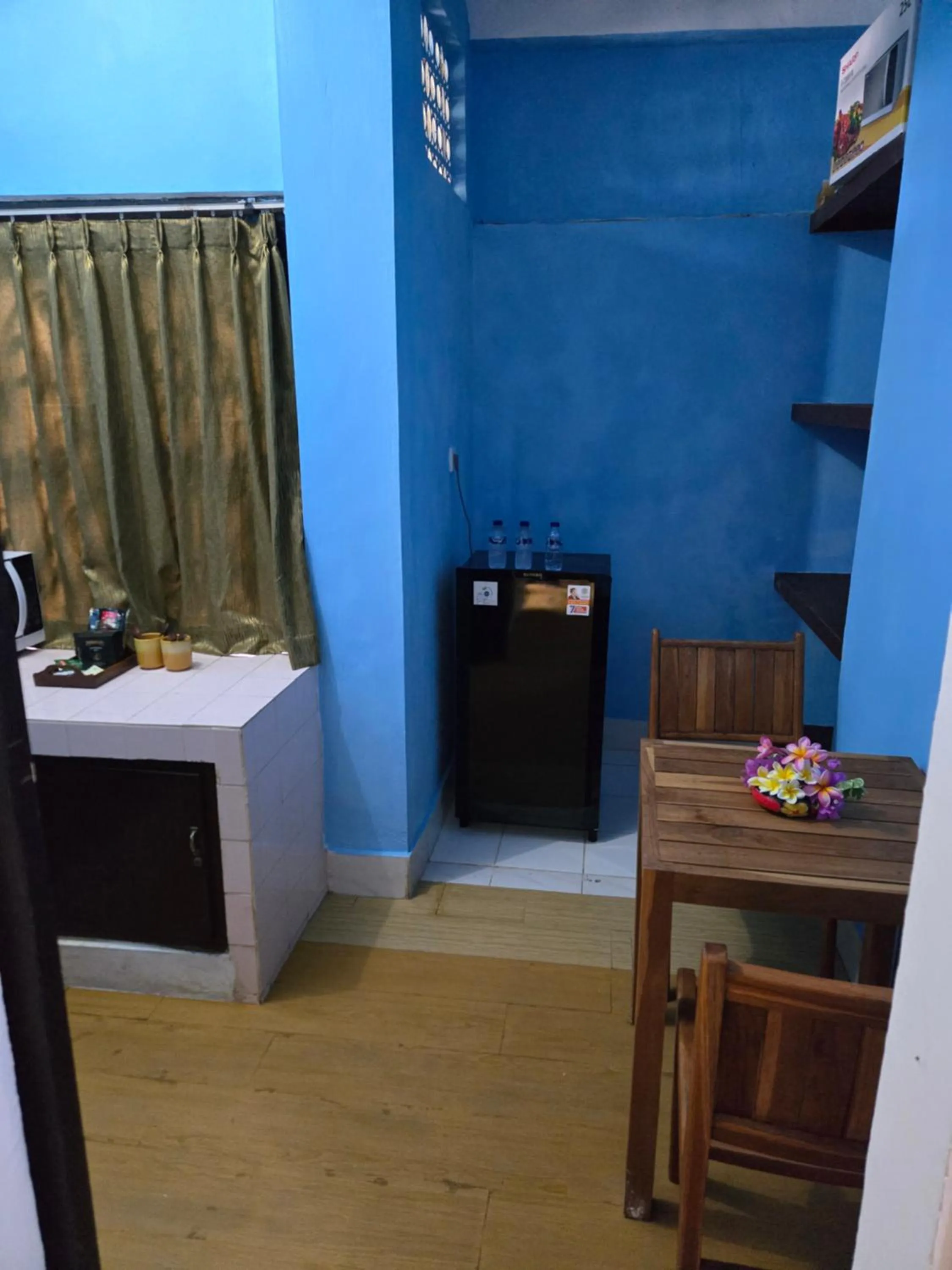 Kitchen or kitchenette in Berlian Inn Kuta Beach