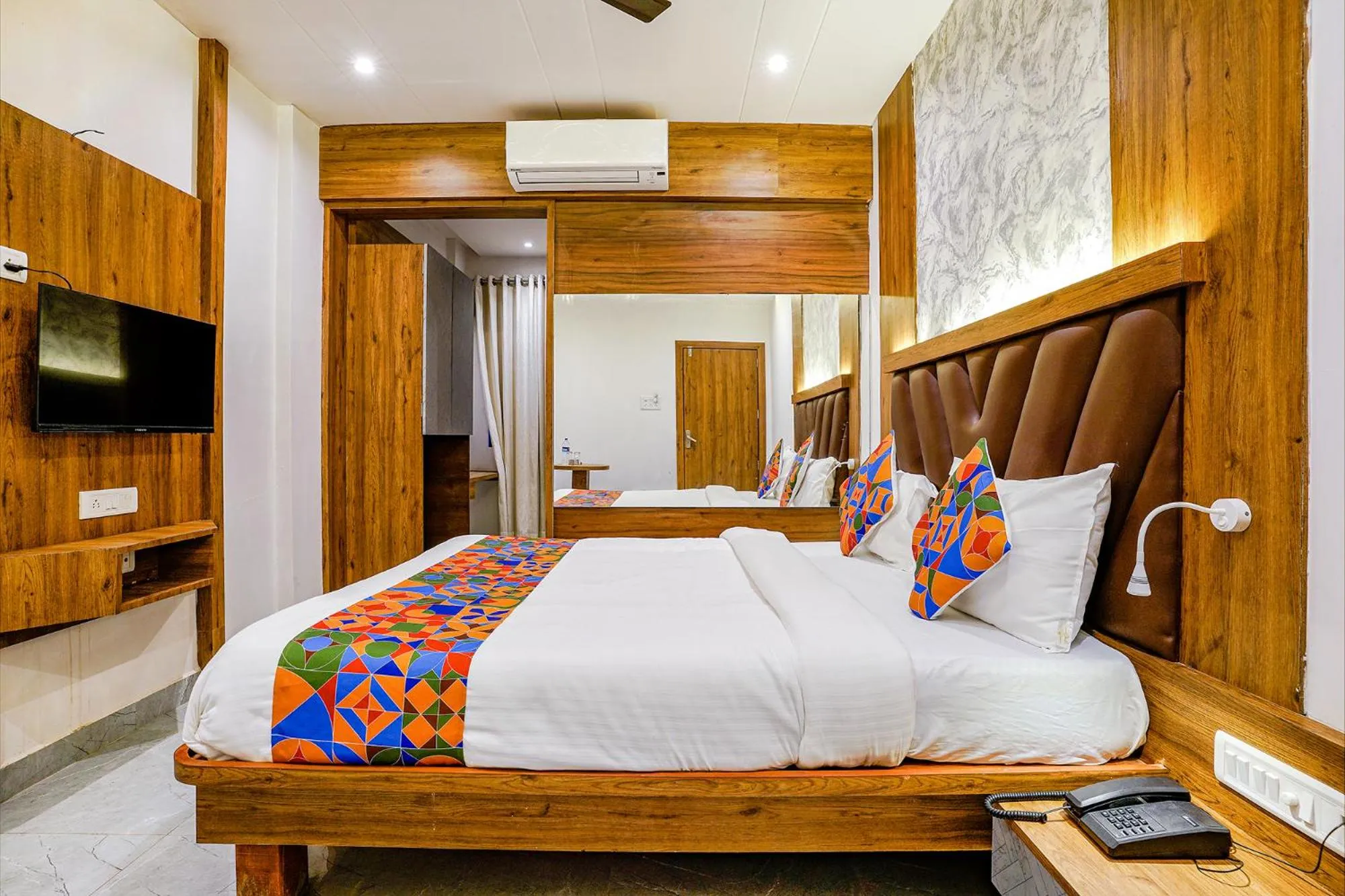 Bed in FabHotel Grand Residency