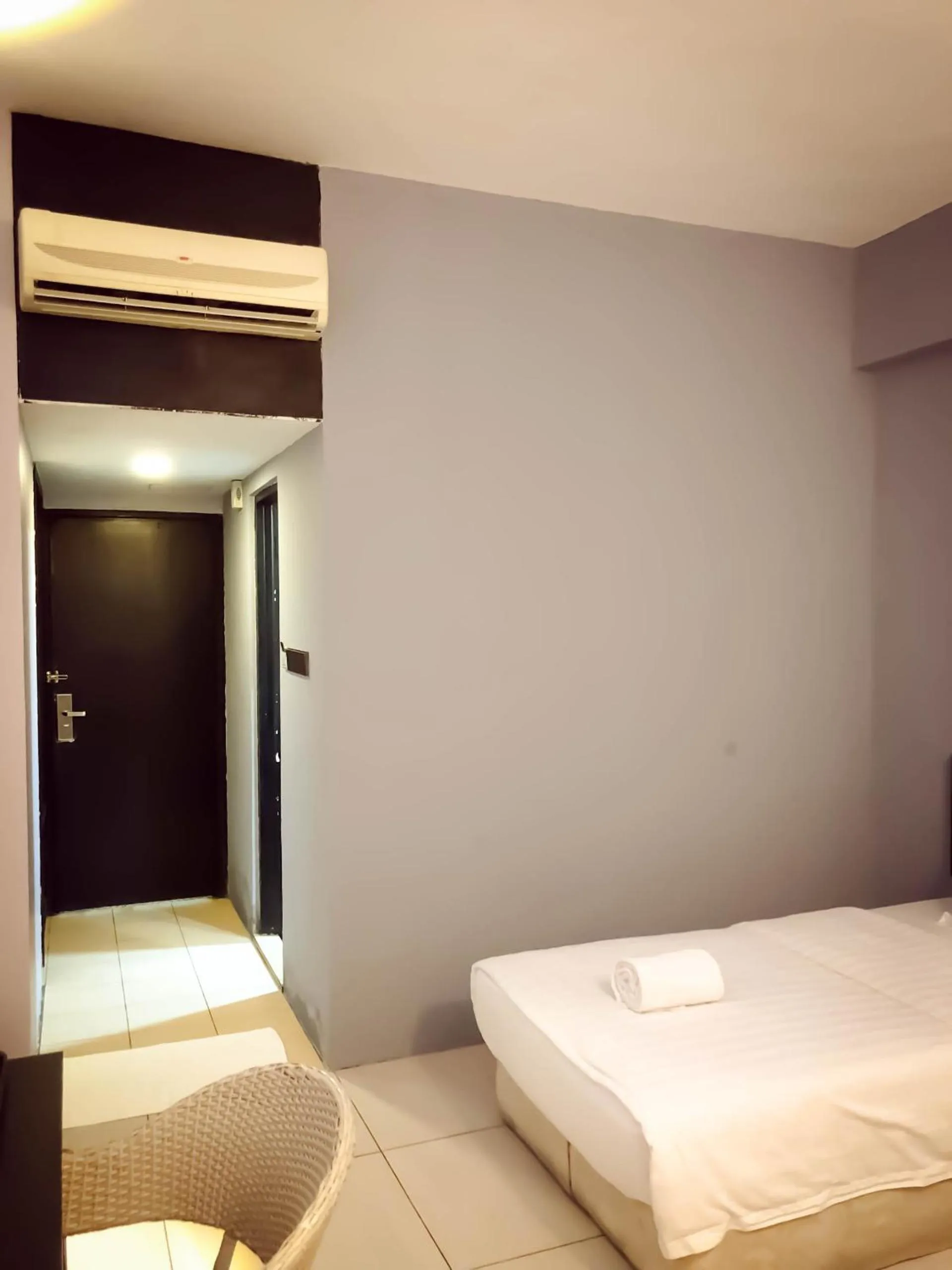 Bed in De Choice Hotel Tawau