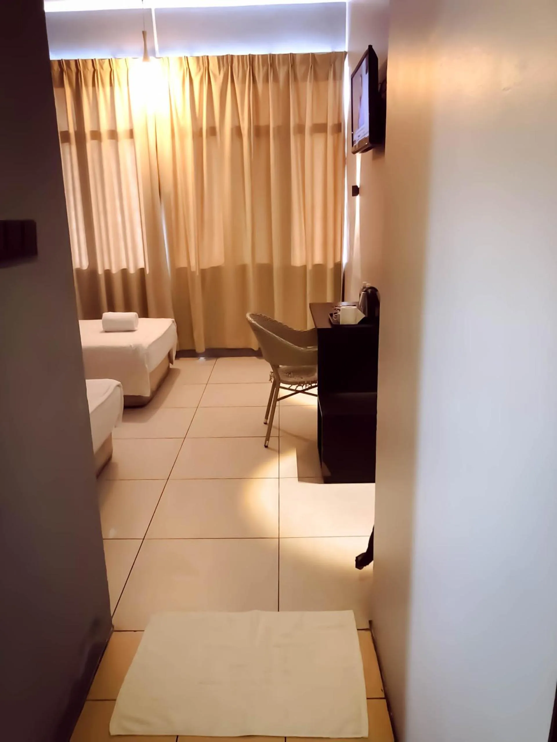 Bed in De Choice Hotel Tawau