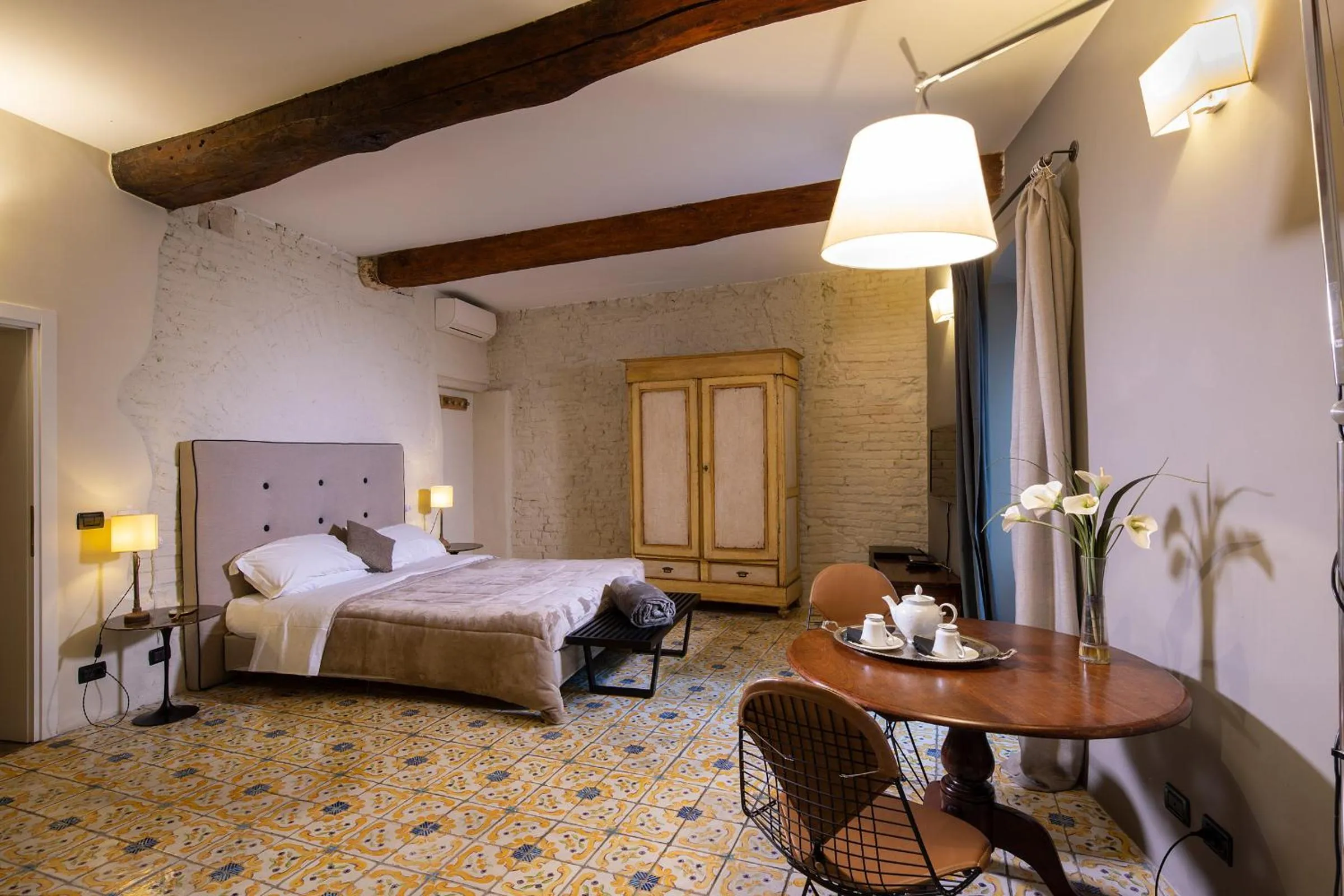 Living room, Bed in Il Battistero Siena Residenza d'Epoca