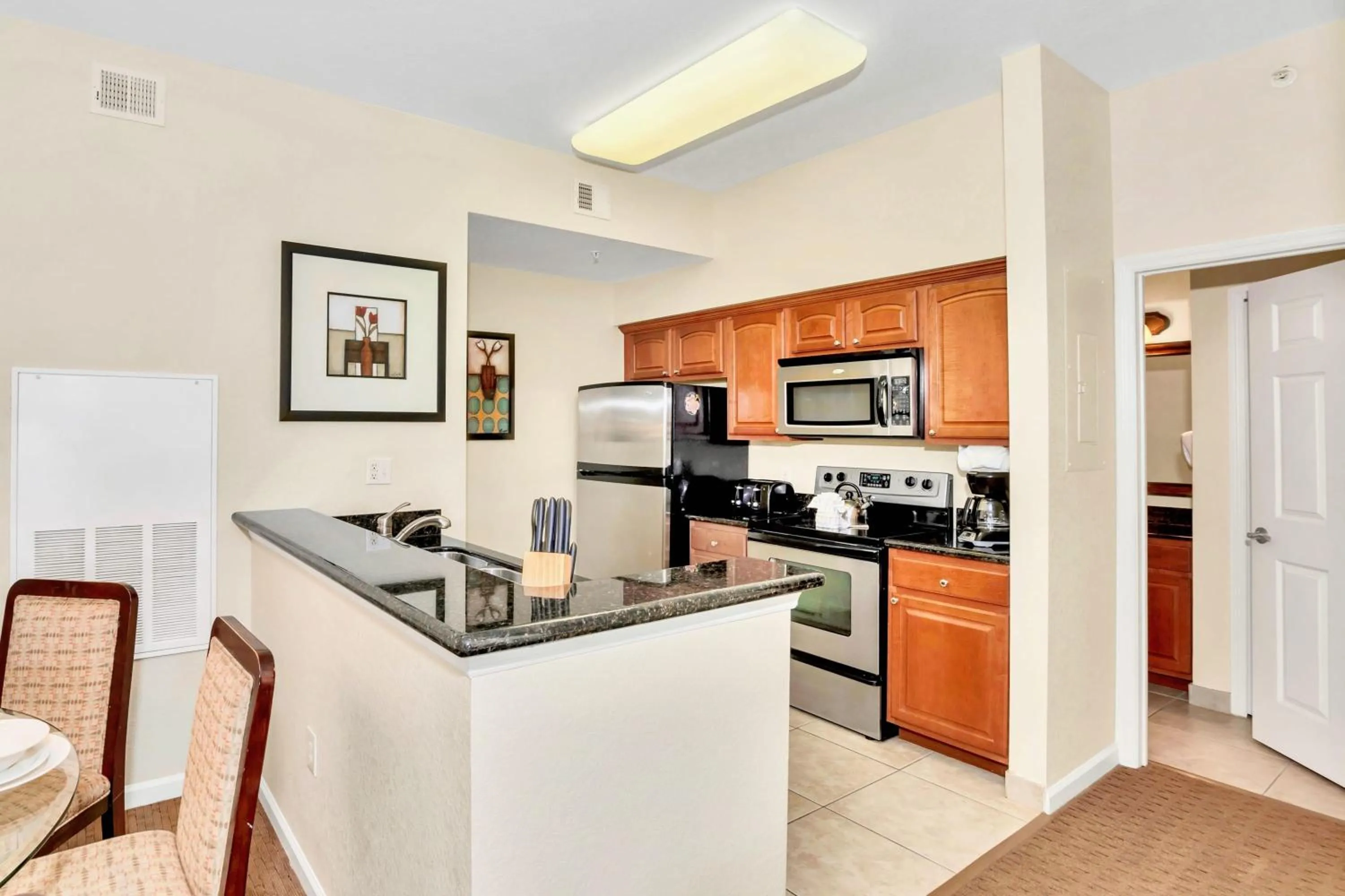 Kitchen or kitchenette in 2BR Resort Suite - Fountain View Private Balcony