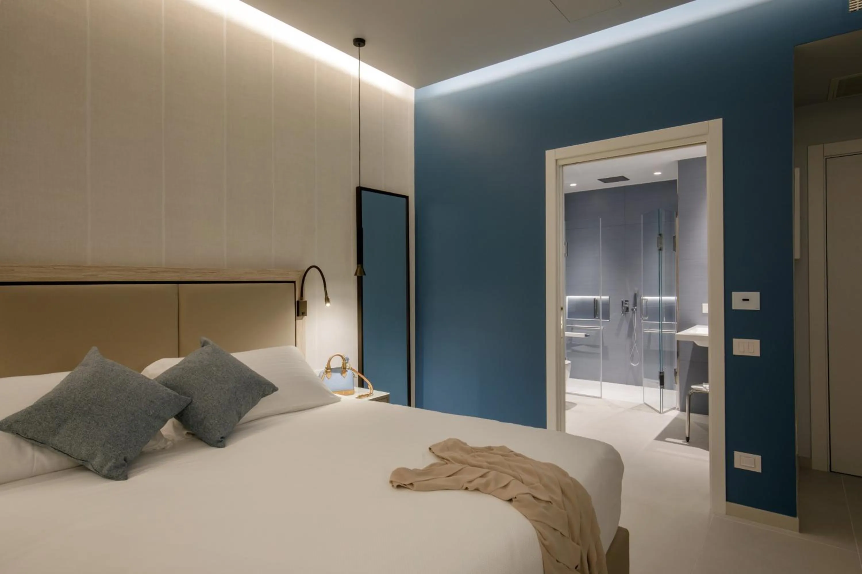 Bed in Ambasciatori Suite Hotel