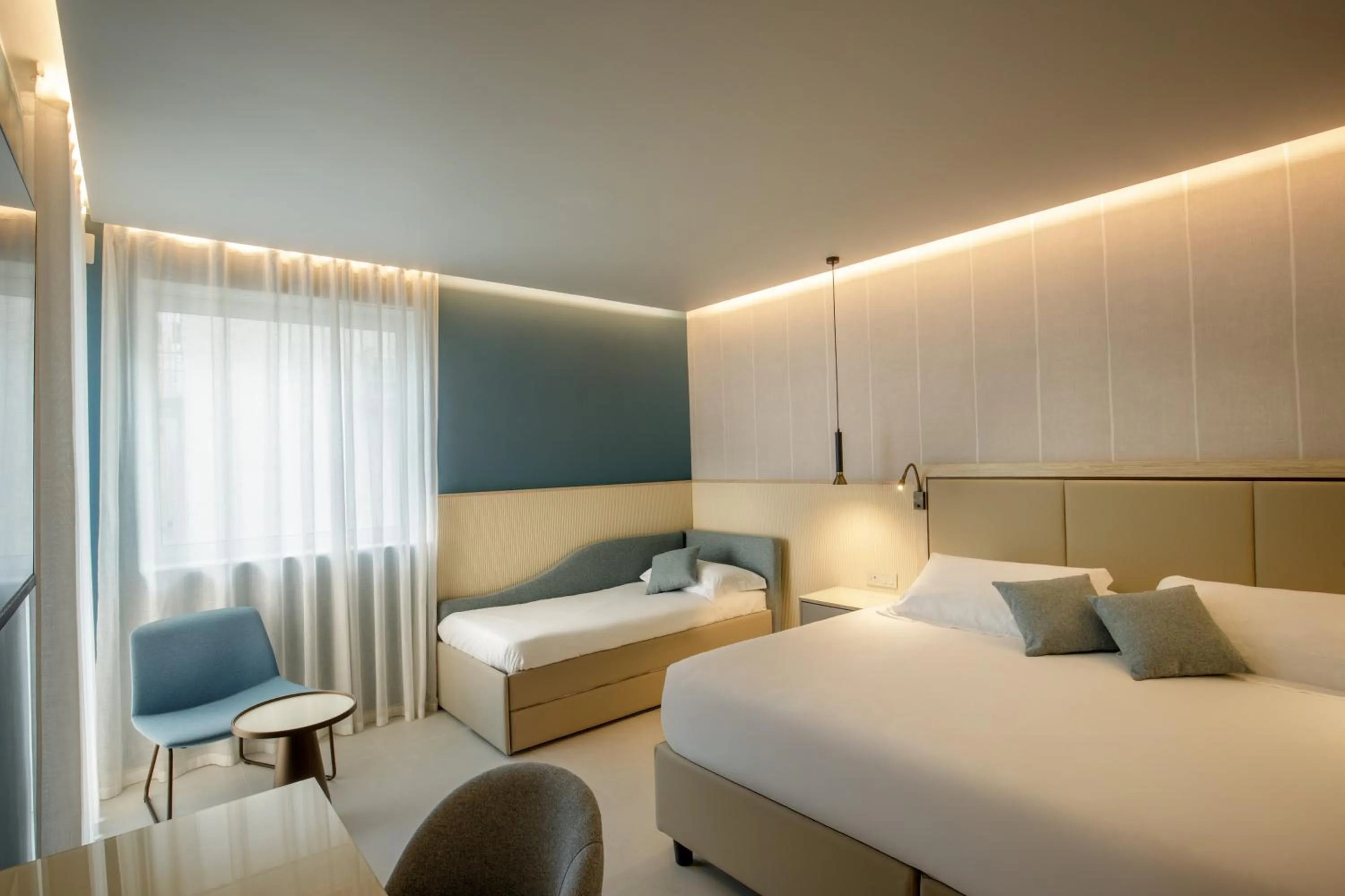 Bed in Ambasciatori Suite Hotel