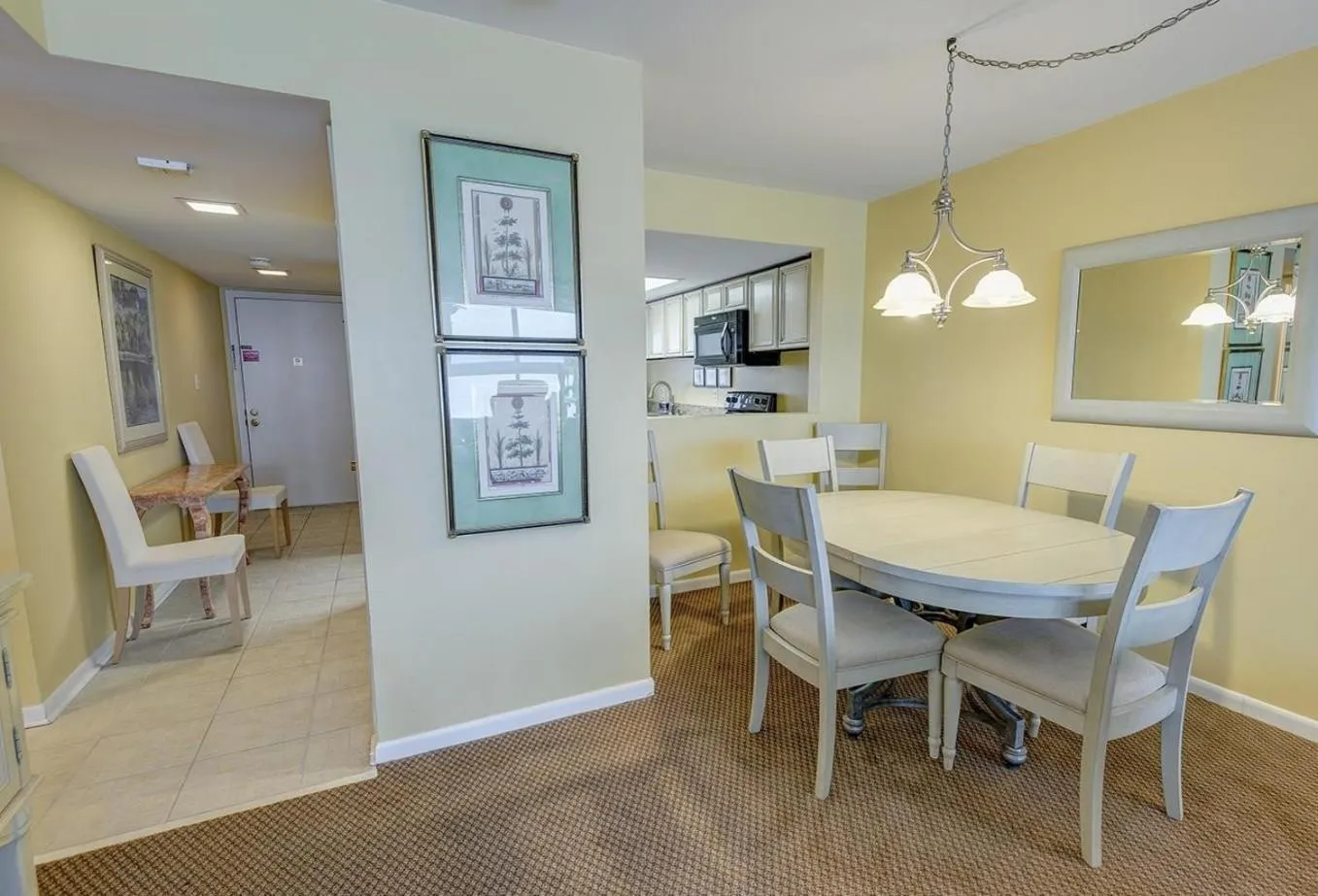 Dining area in Edgewater West 53 by ALBVR - This Beachfront Condo is Perfect for your next Family Getaway