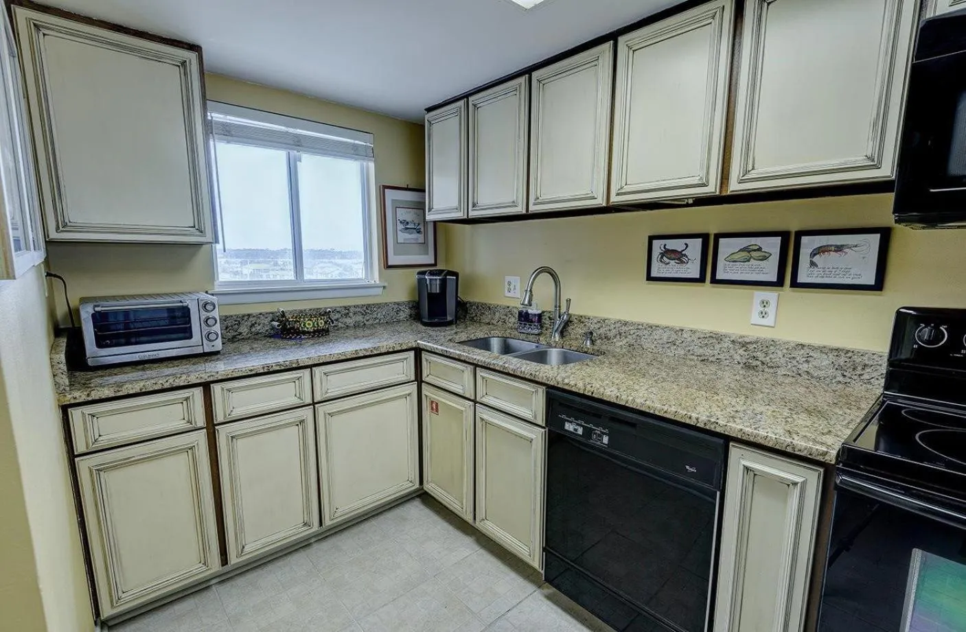 Kitchen or kitchenette in Edgewater West 53 by ALBVR - This Beachfront Condo is Perfect for your next Family Getaway