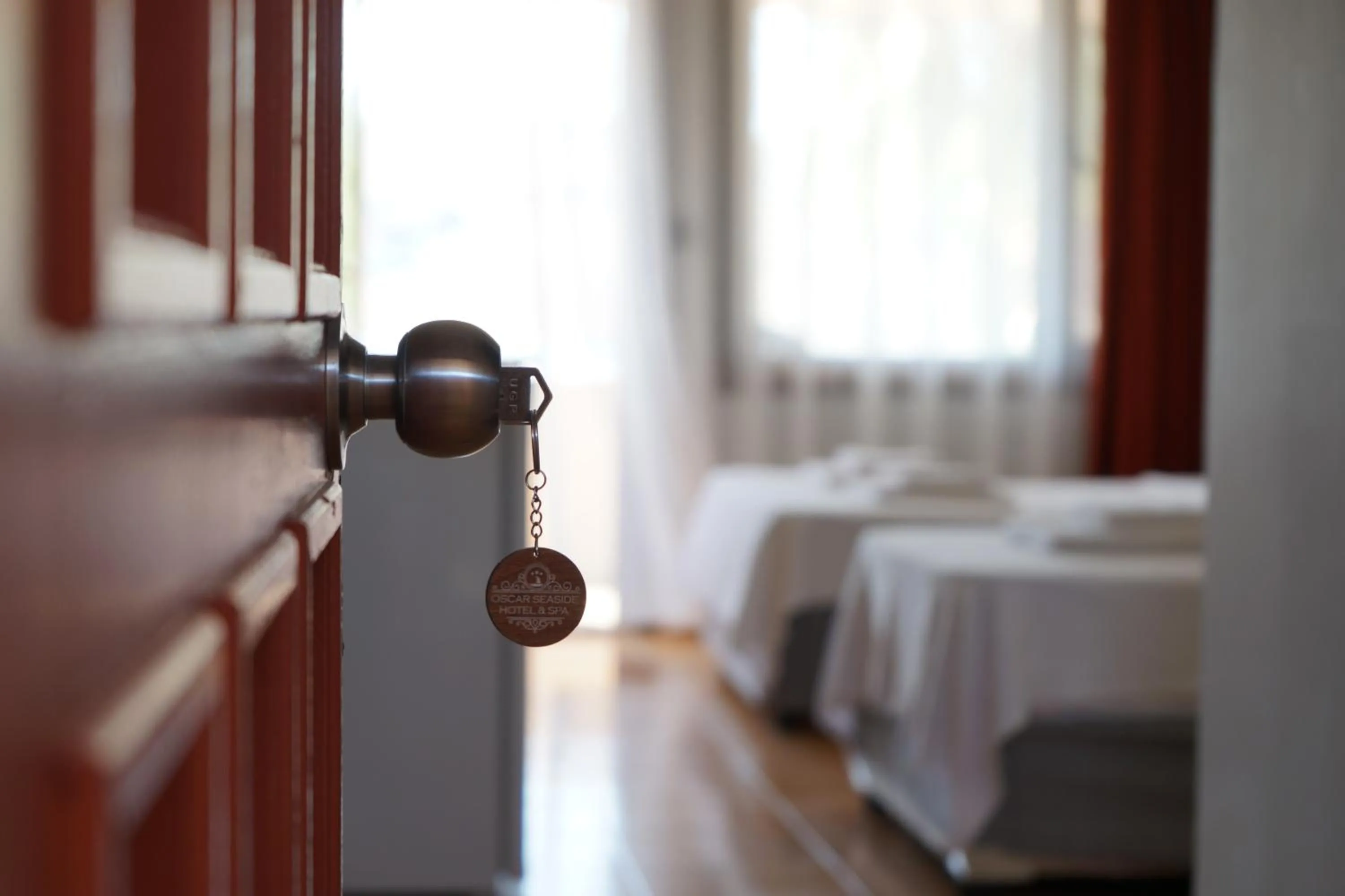 Bed in Oscar Seaside Hotel & Spa