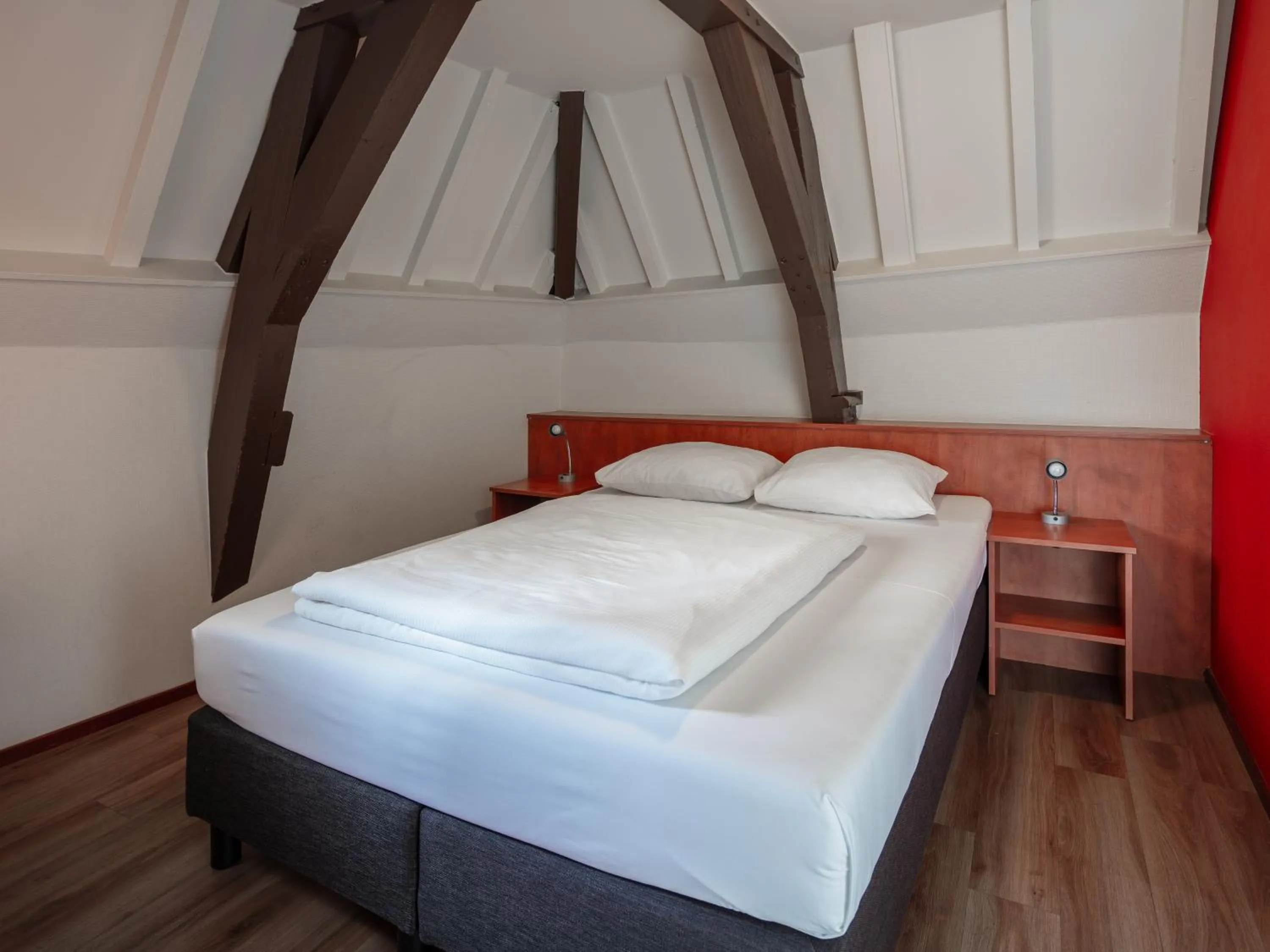 Bed in A-Train Hotel