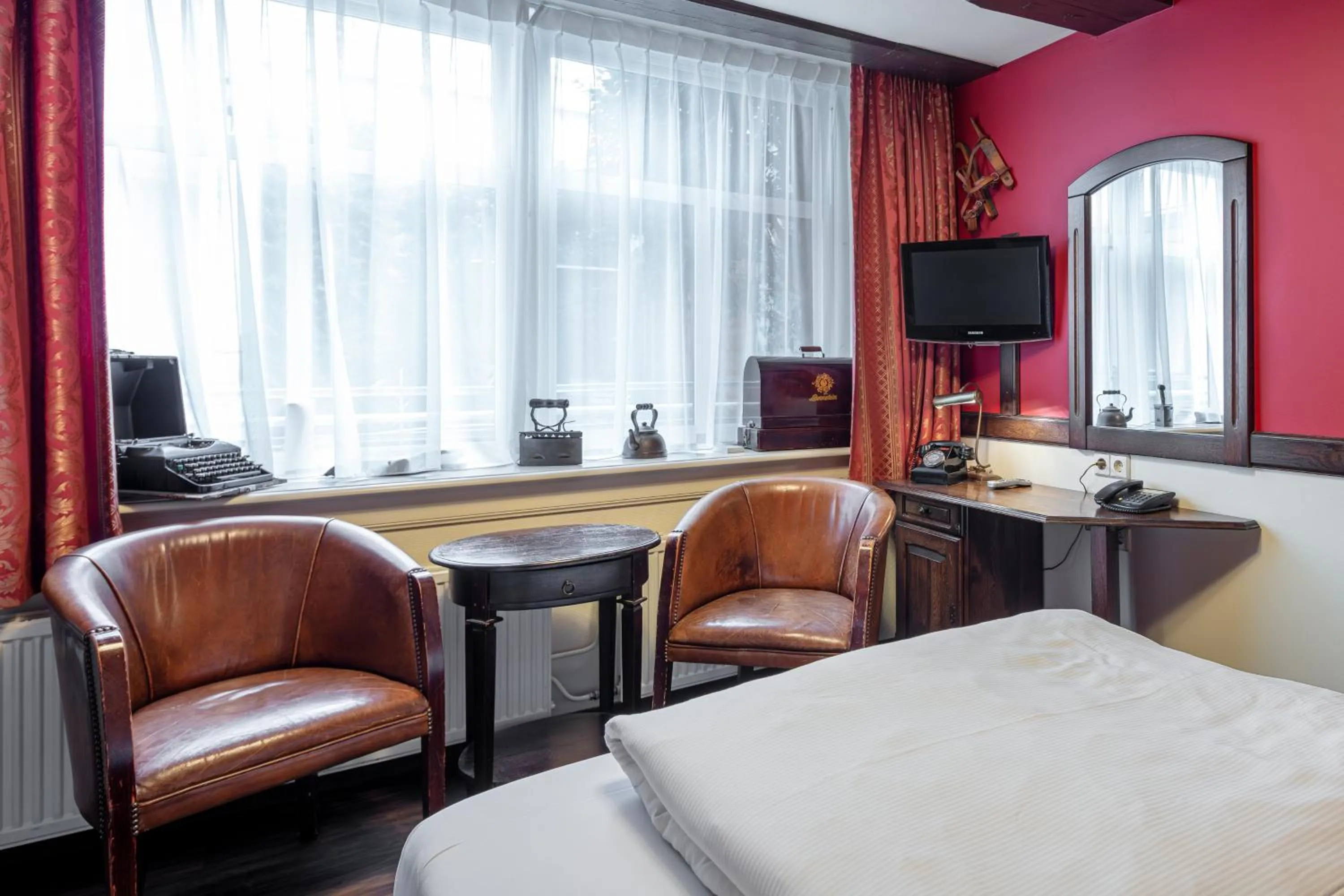 Seating area, Bed in A-Train Hotel