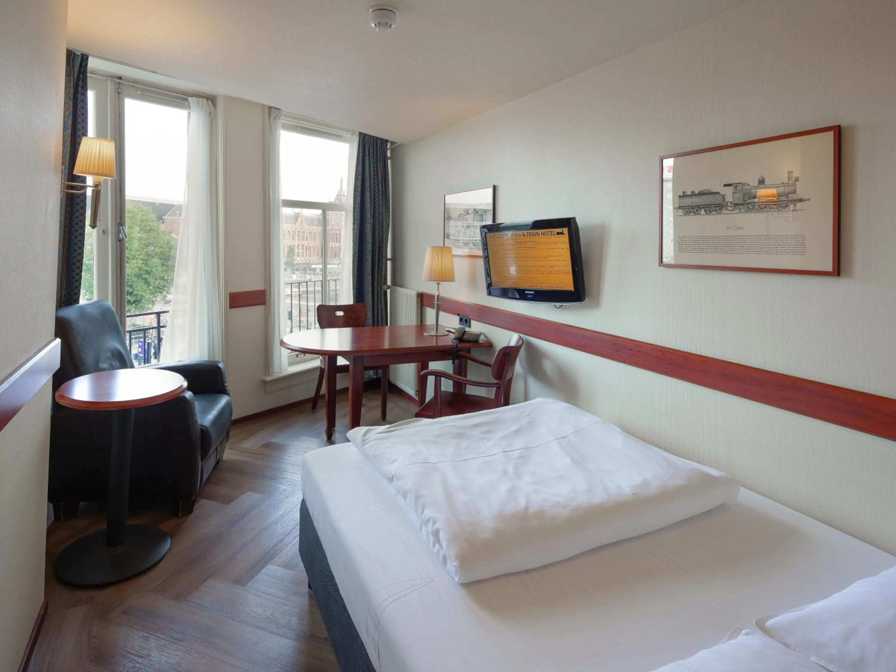 Bed in A-Train Hotel