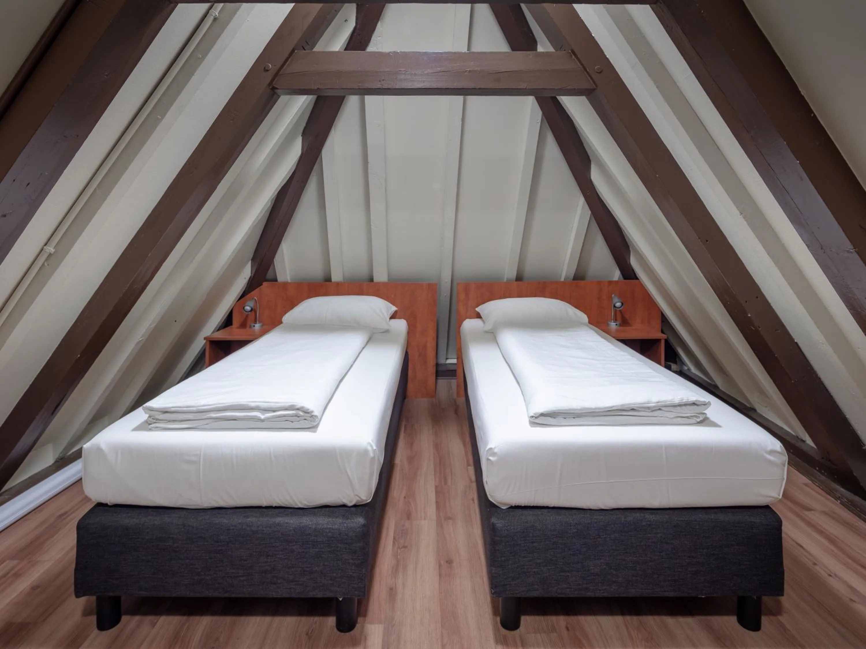 Bed in A-Train Hotel