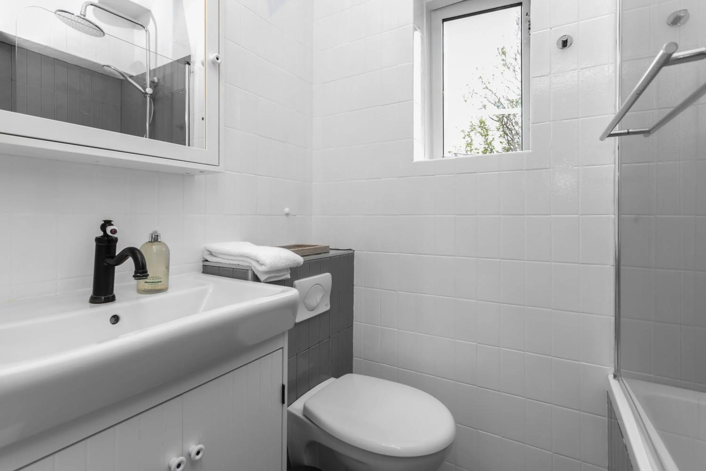 Toilet in Cozy 2BR Apartment