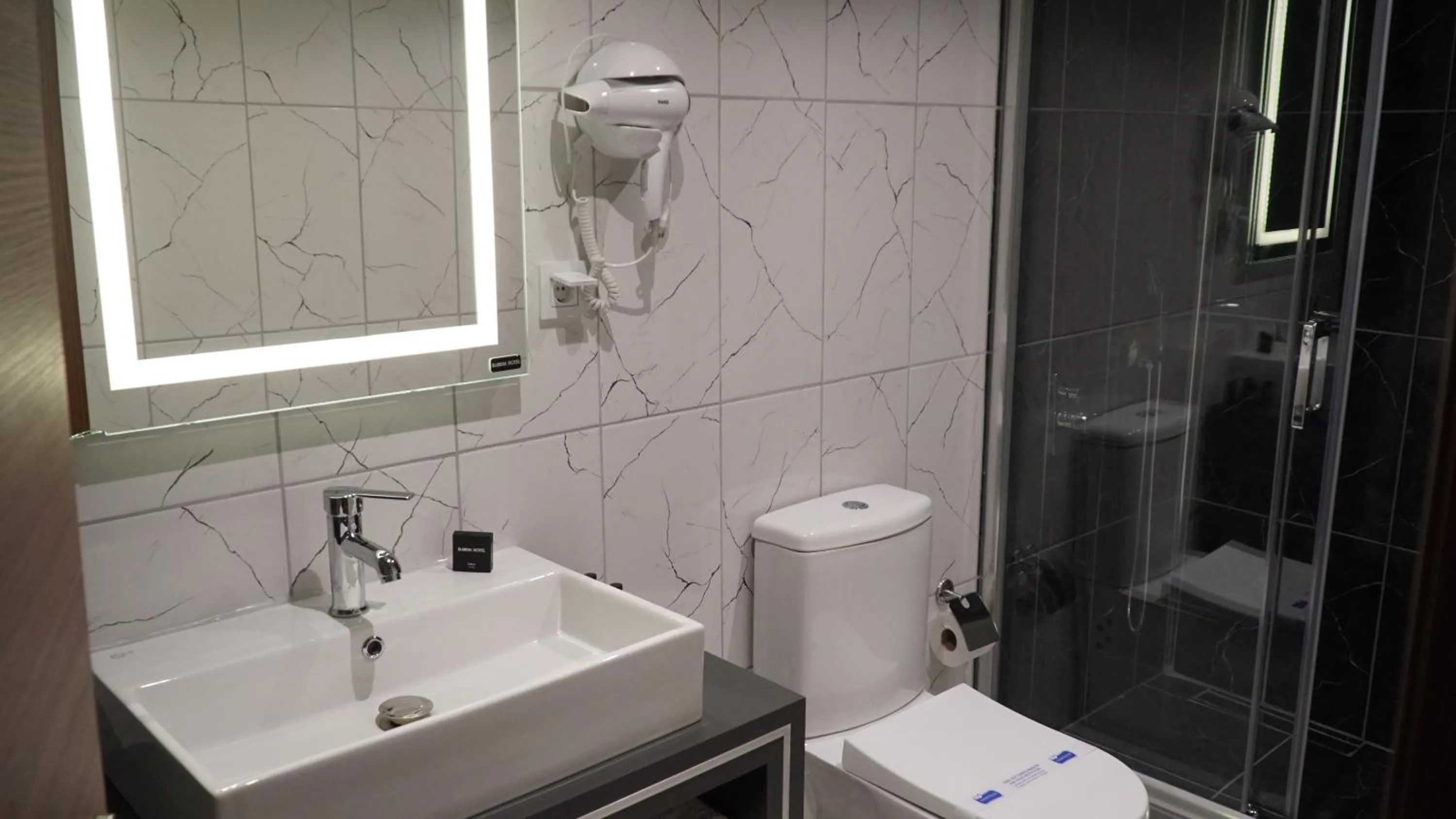 Bathroom in Bloom Suite Hotel