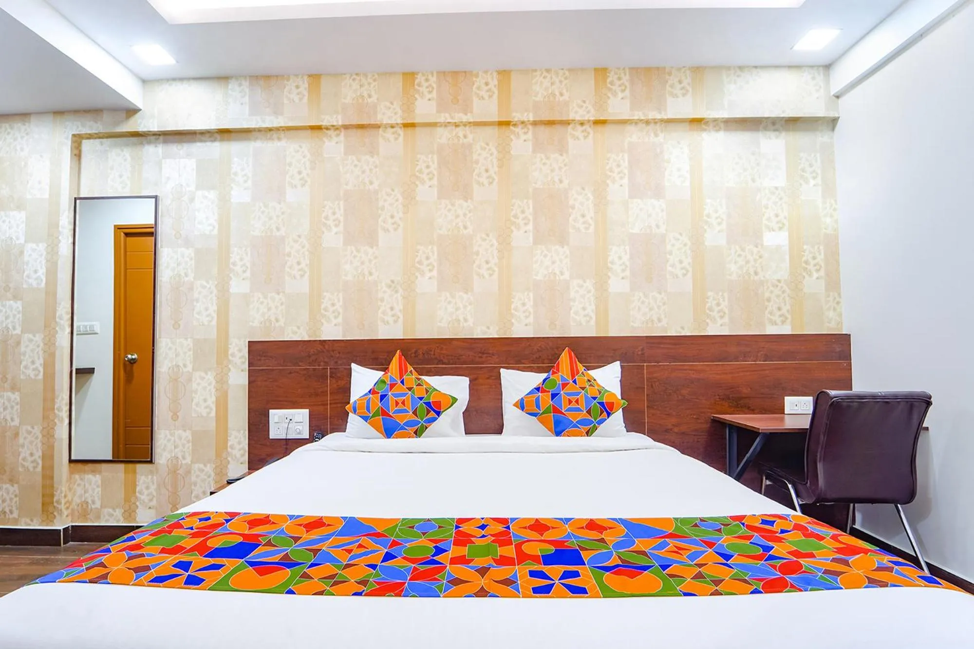 Bed in FabHotel Ellegant Inn