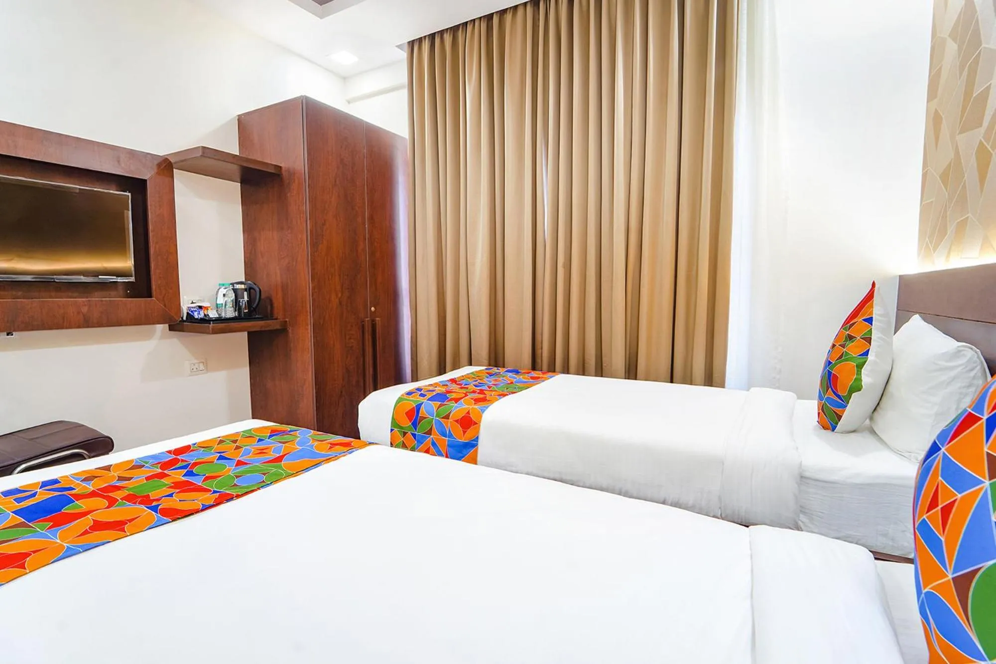 Bed in FabHotel Ellegant Inn