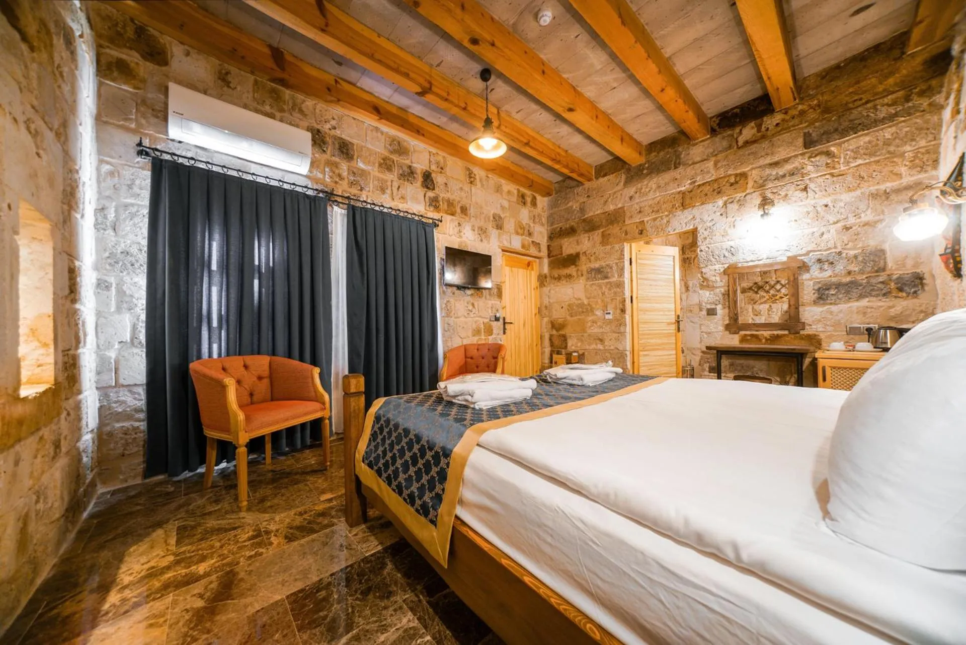 Bed in Caverna Hotel Premium Caves