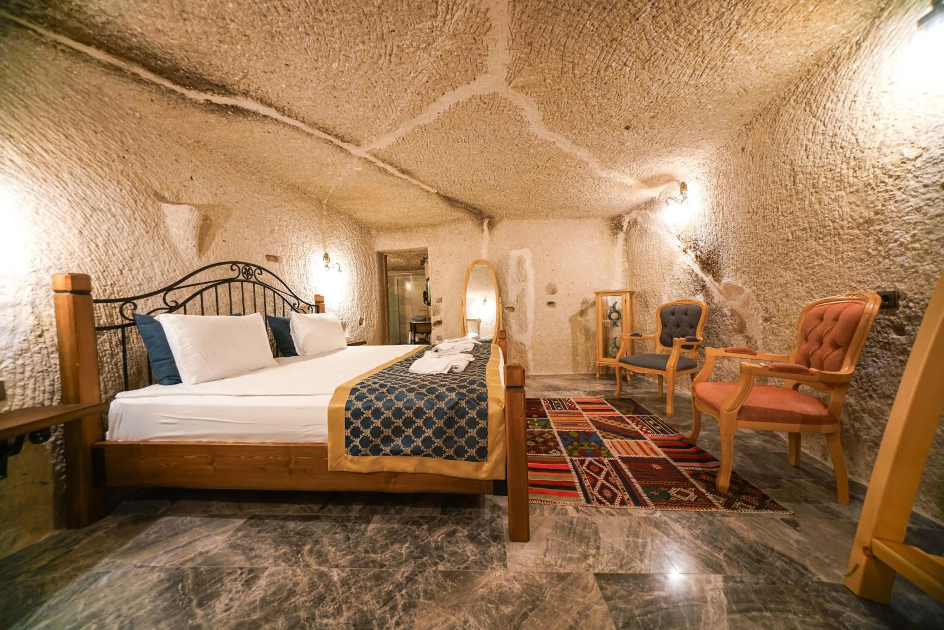 Bed in Caverna Hotel Premium Caves