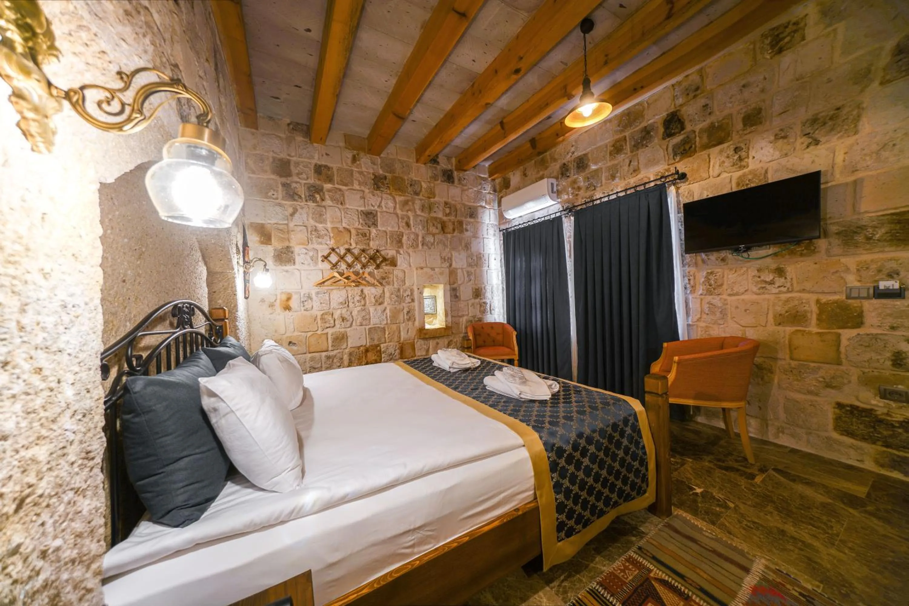 Bed in Caverna Hotel Premium Caves