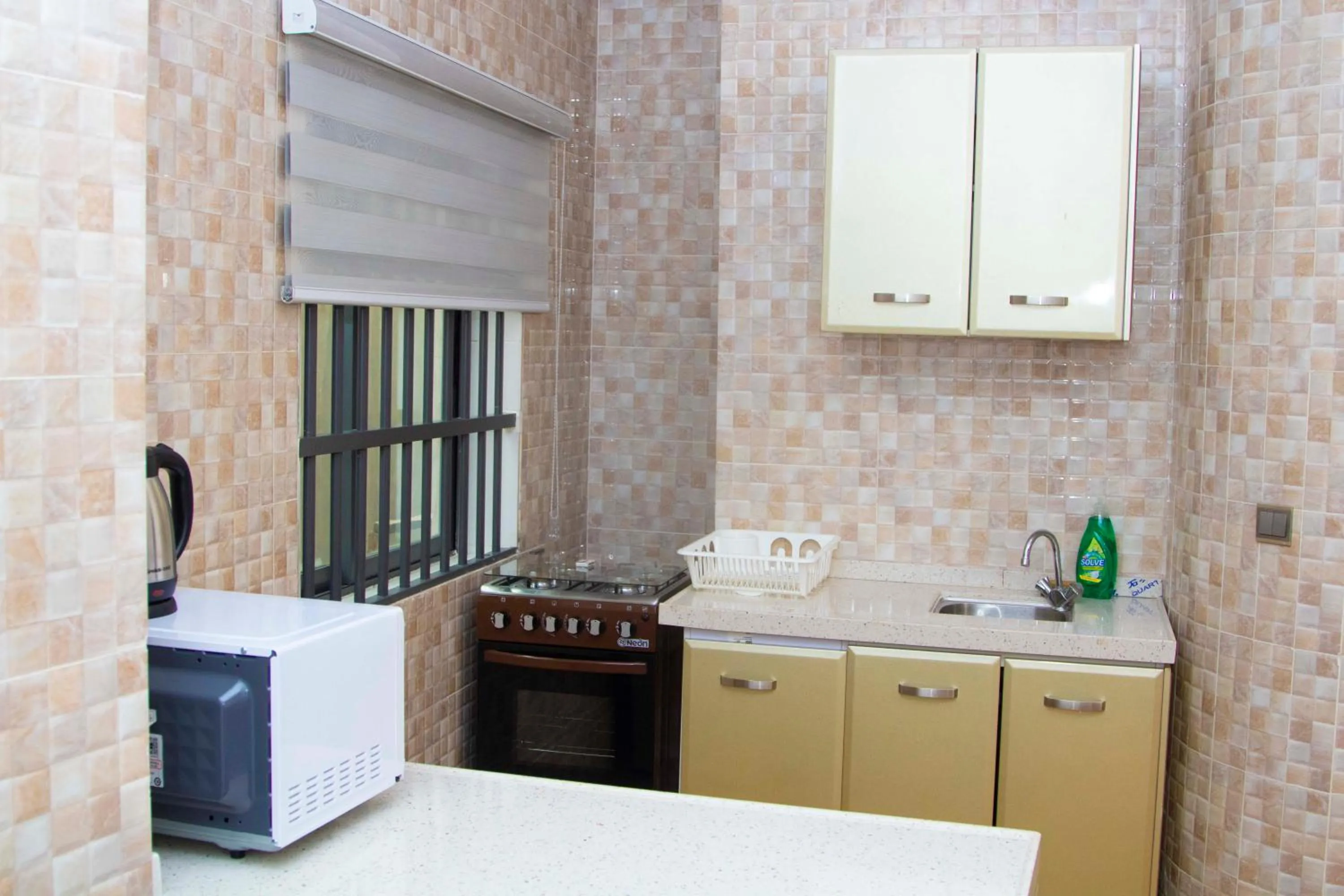 Kitchen or kitchenette in Les Ombrelles Appart'Hotel