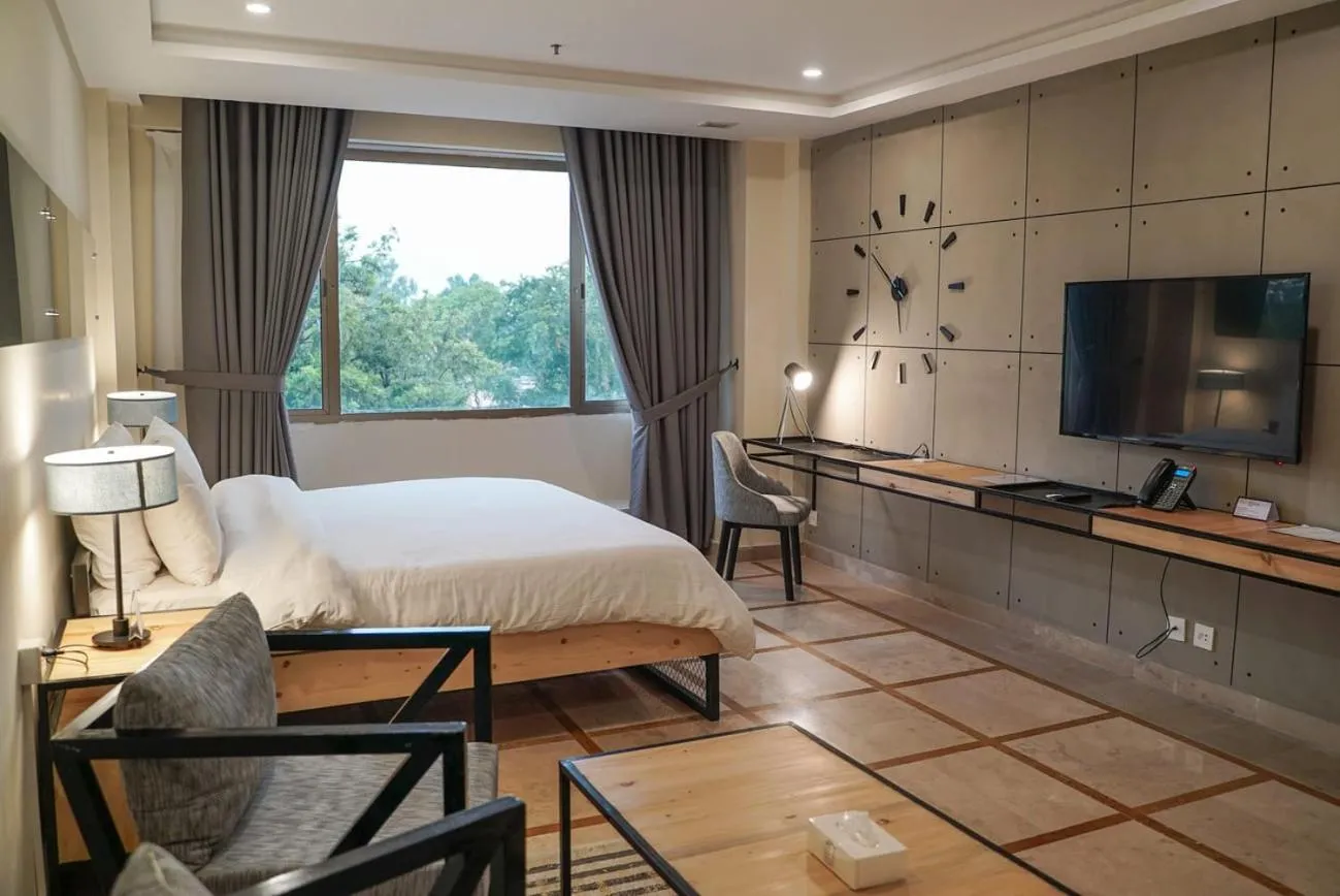 Bed in Roomy Signature Hotel, Islamabad