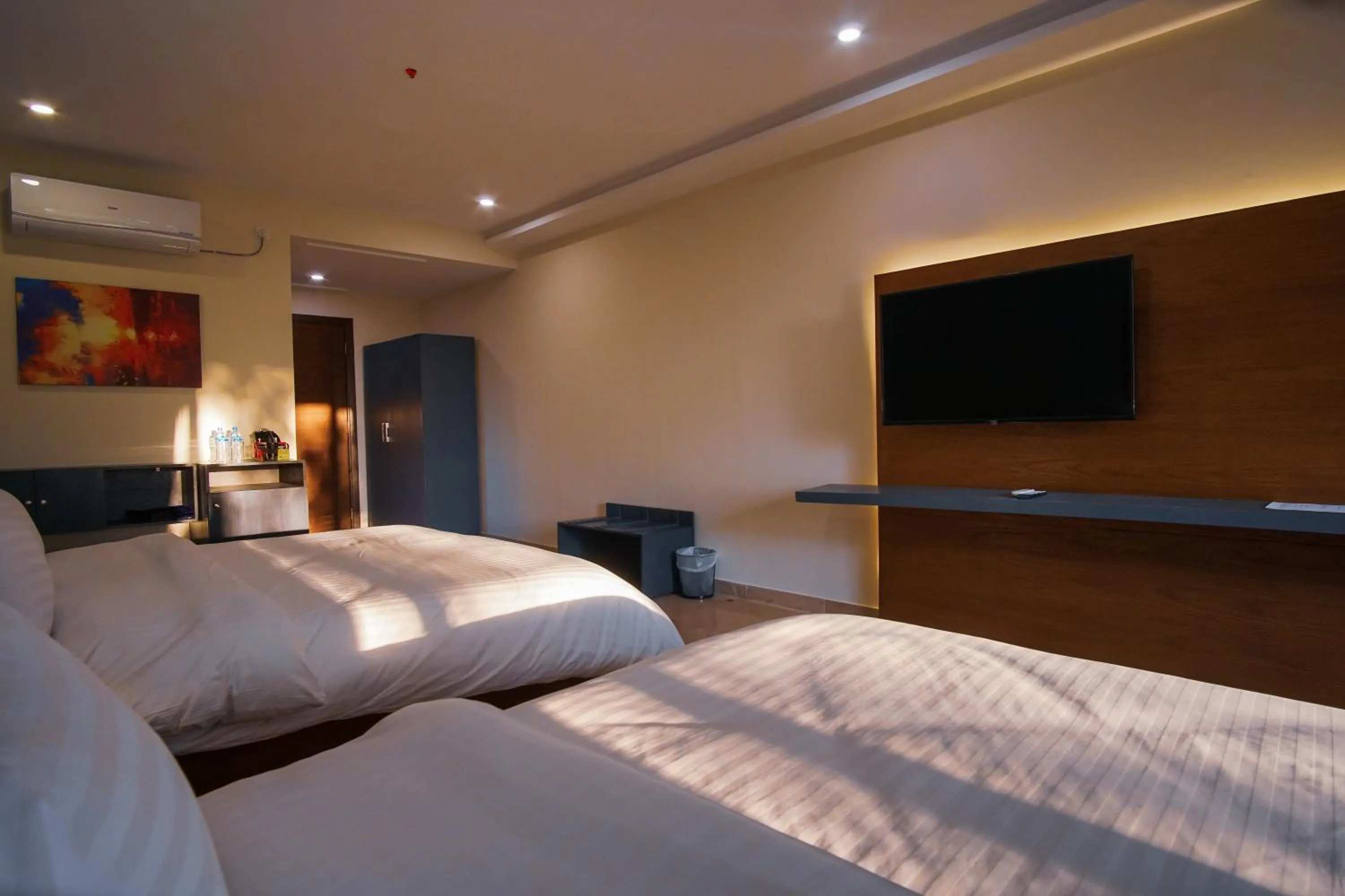 Bed in Roomy Signature Hotel, Islamabad