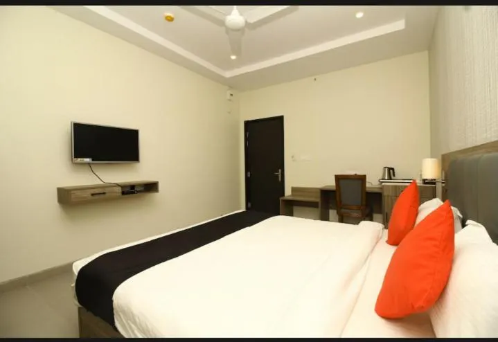 Bed in Hotel Sindhura Grand