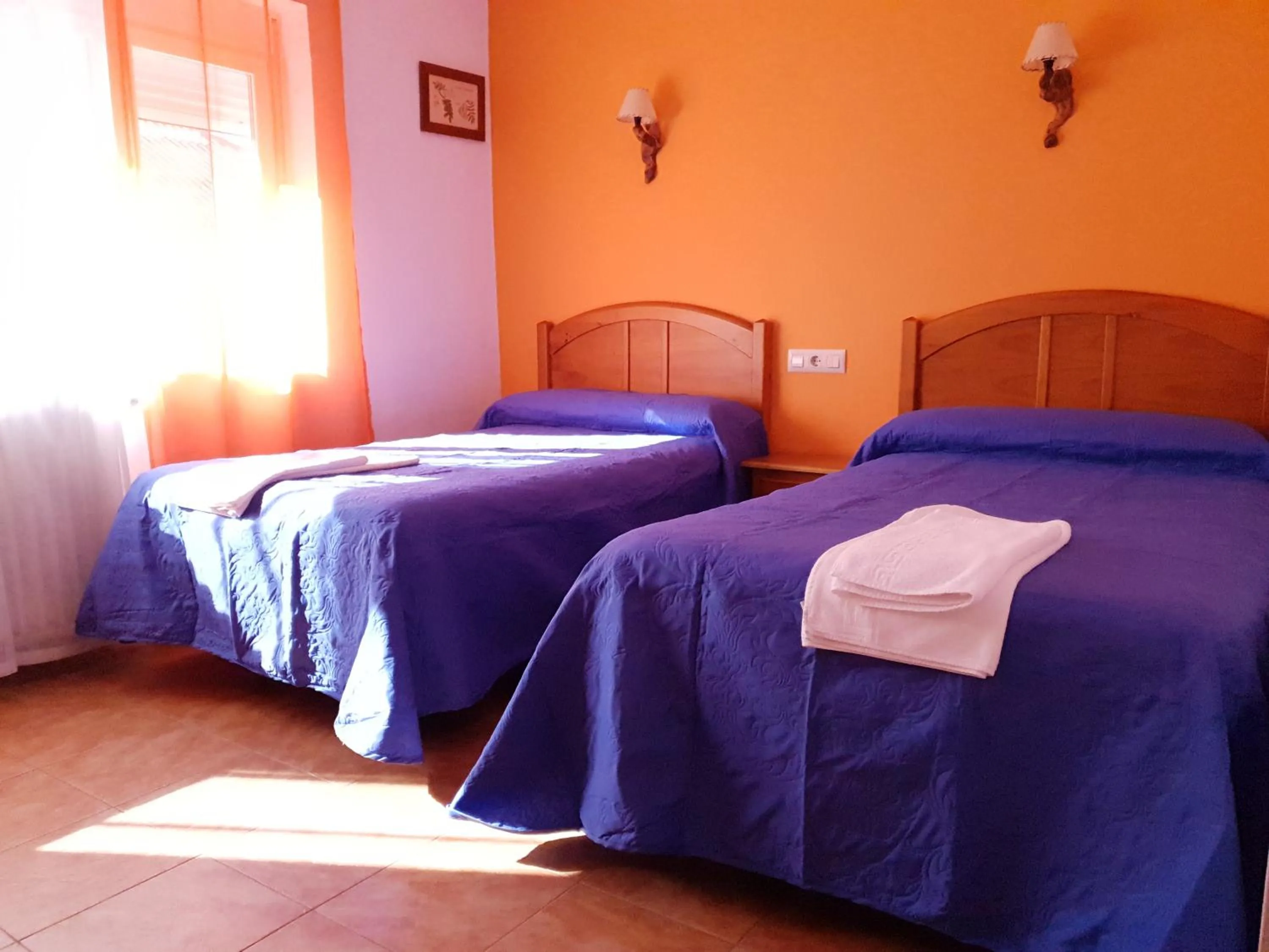 Bed in Hostal Río Mundo