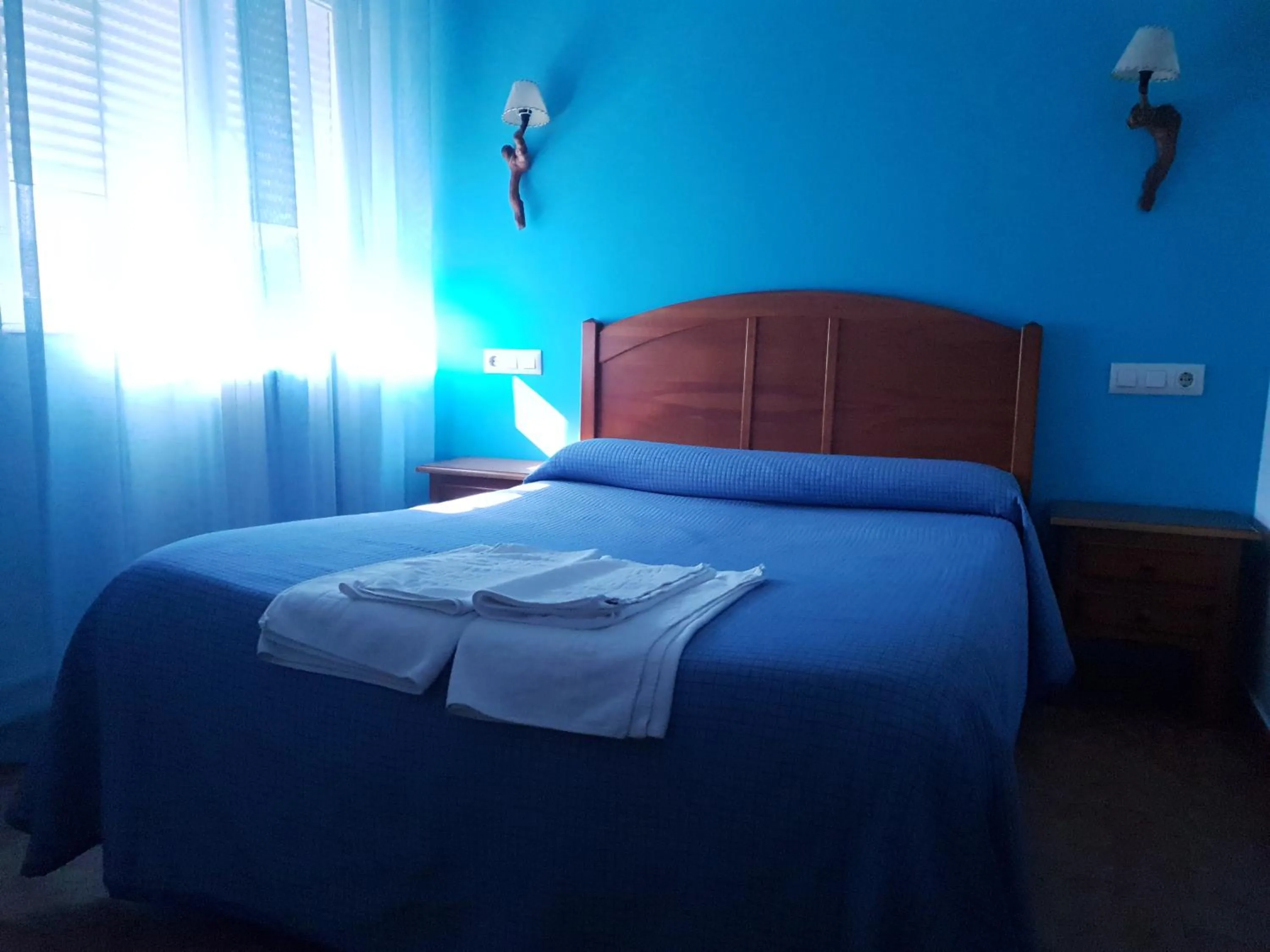 Bed in Hostal Río Mundo