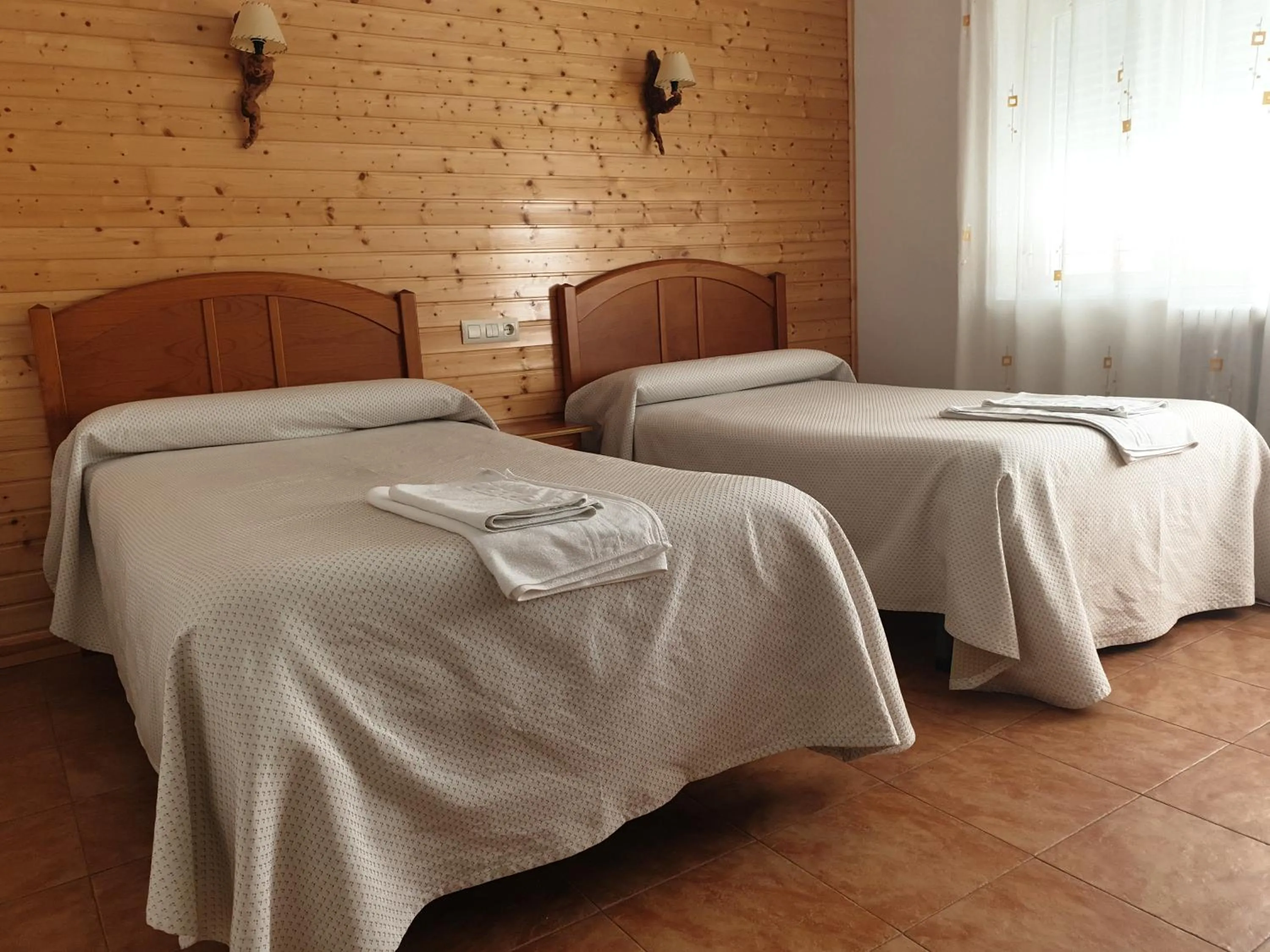 Bed in Hostal Río Mundo