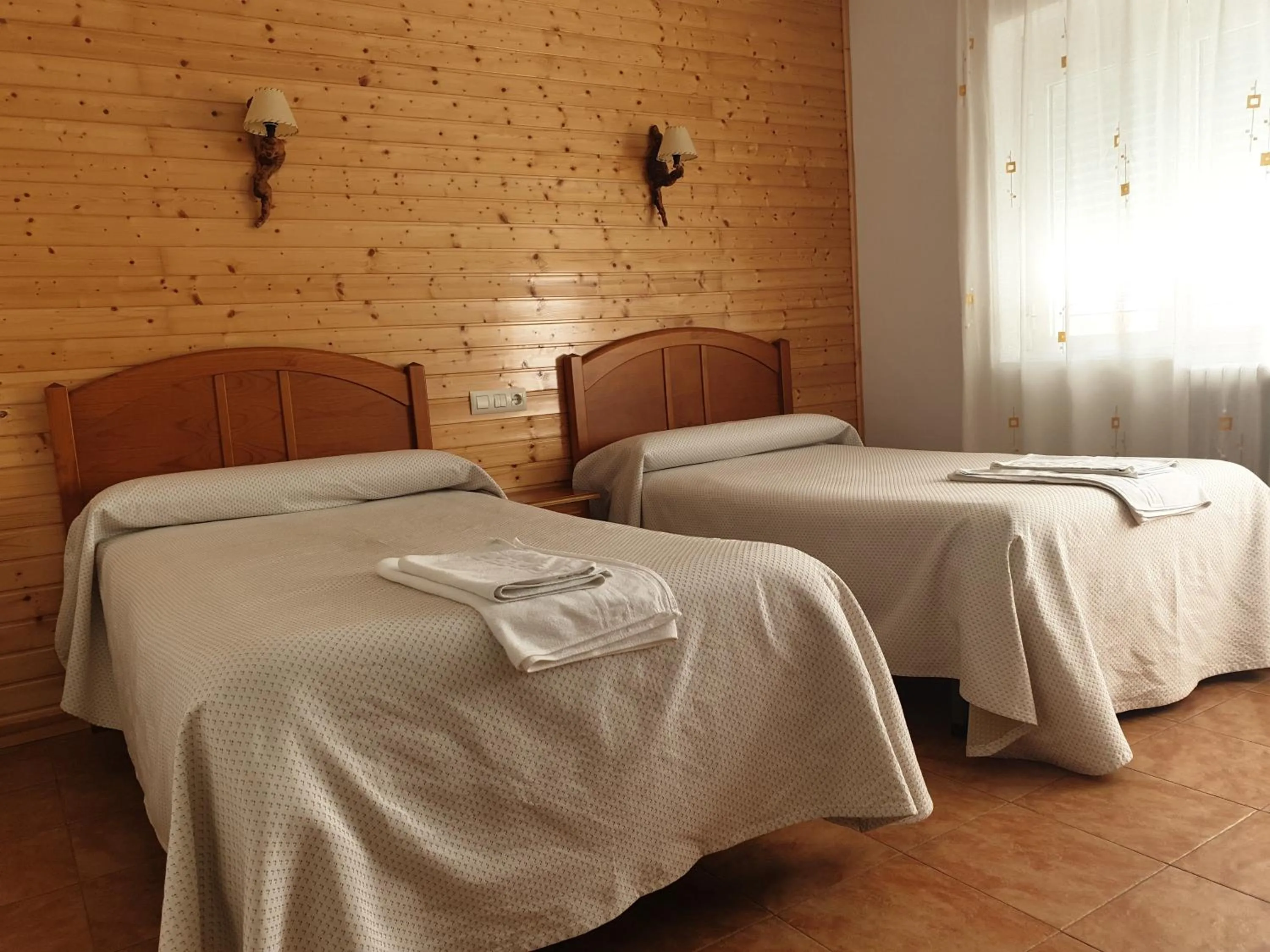 Bed in Hostal Río Mundo