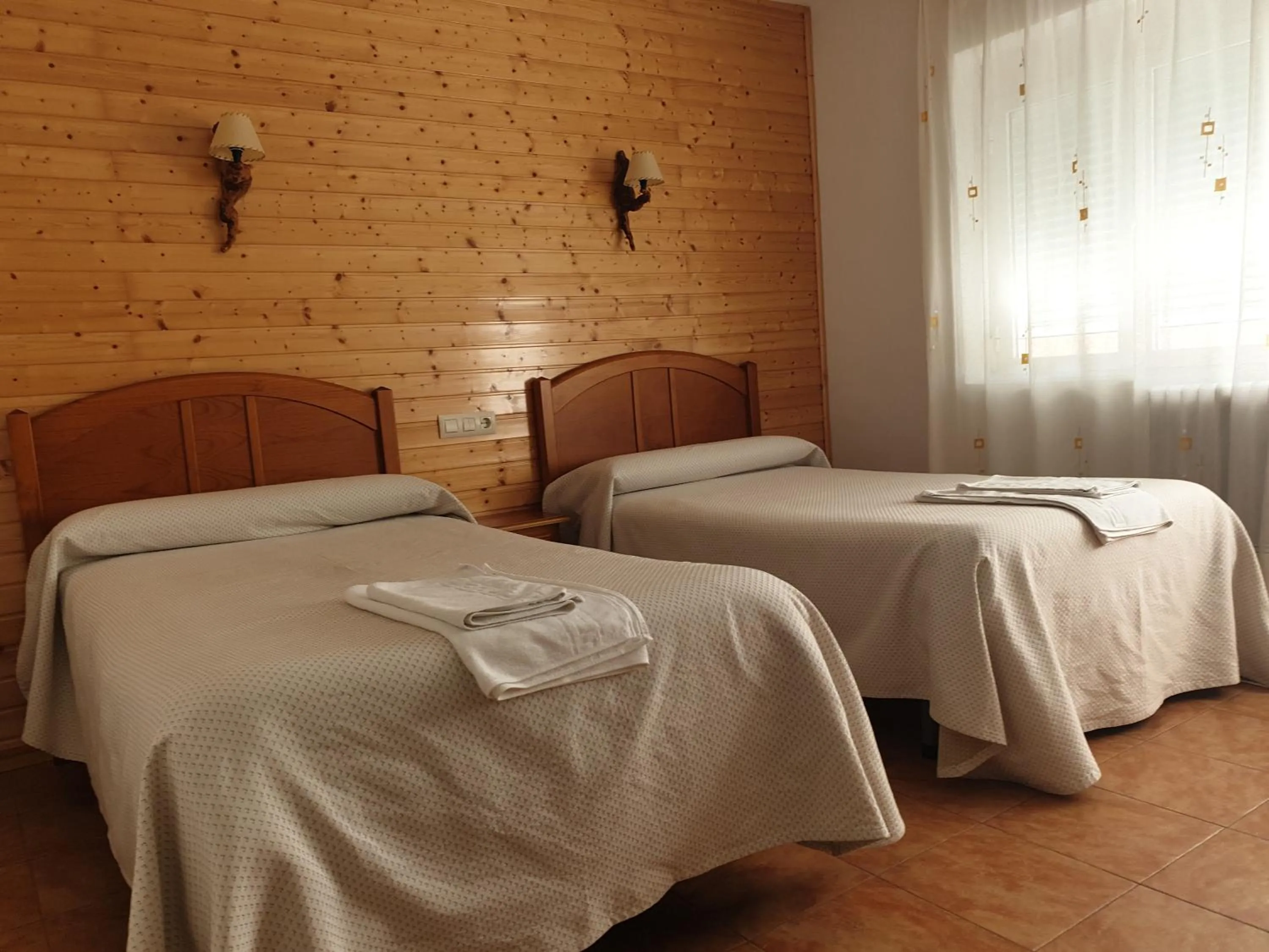 Bed in Hostal Río Mundo
