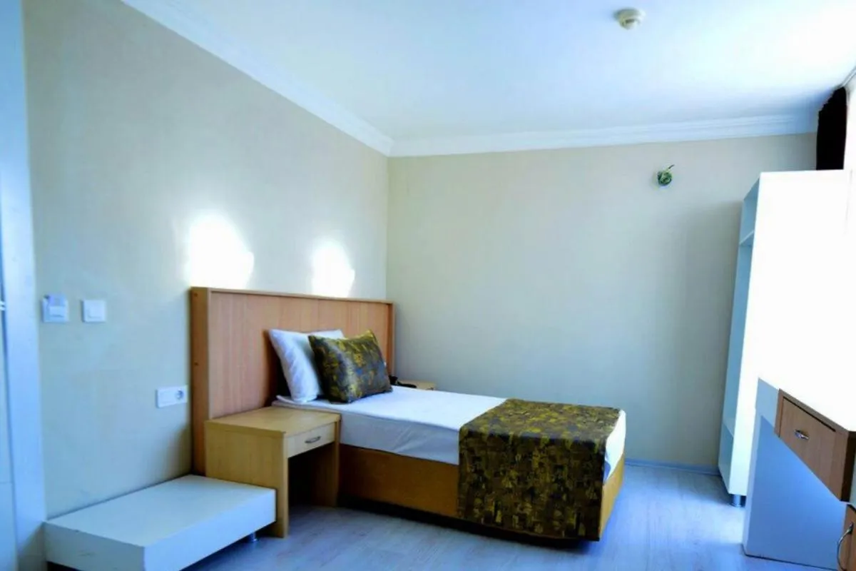 Bed in Side Orange Paradise Hotel