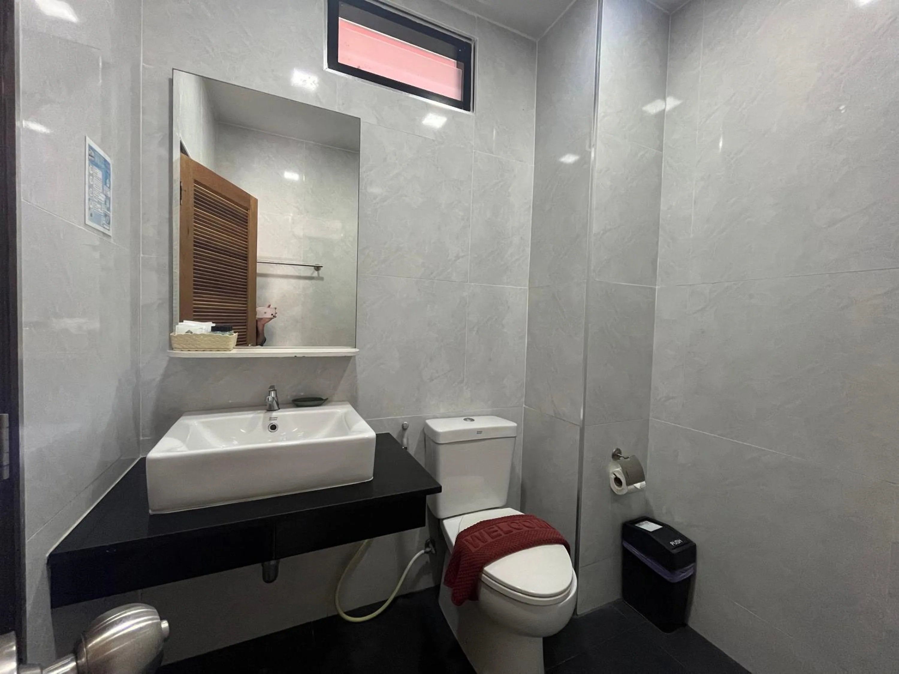 Toilet in Coco Bella Hotel