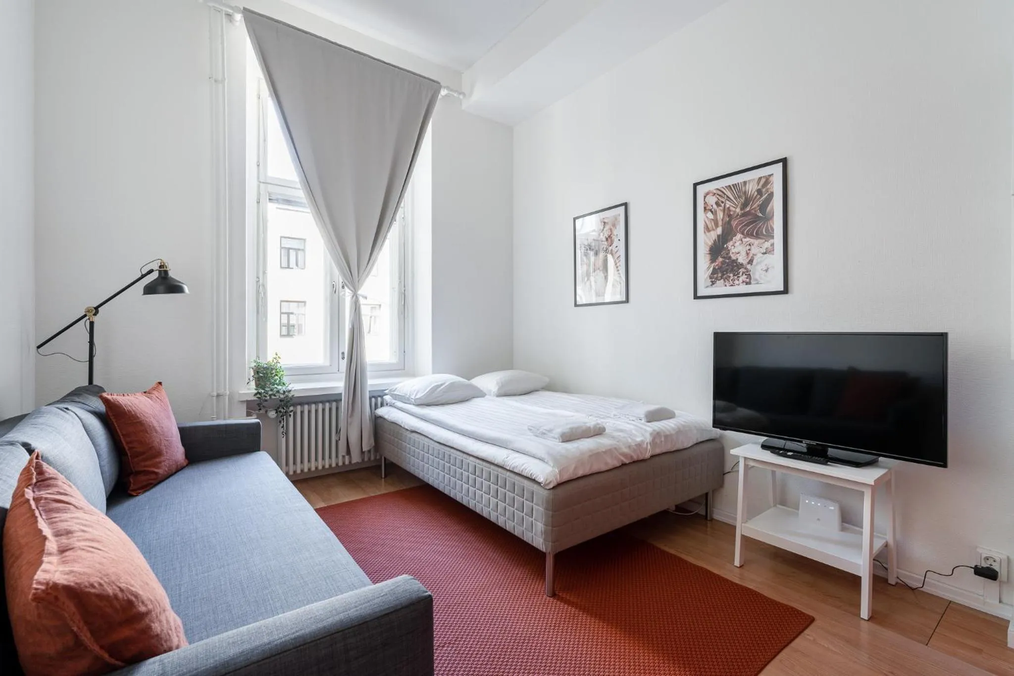 Living room, Bed in Historical 3BR Downtown Apartment with Sauna