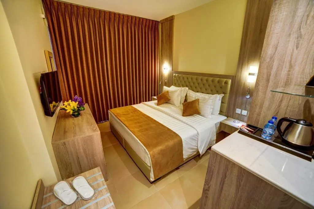 Bed in De-Lara hotel