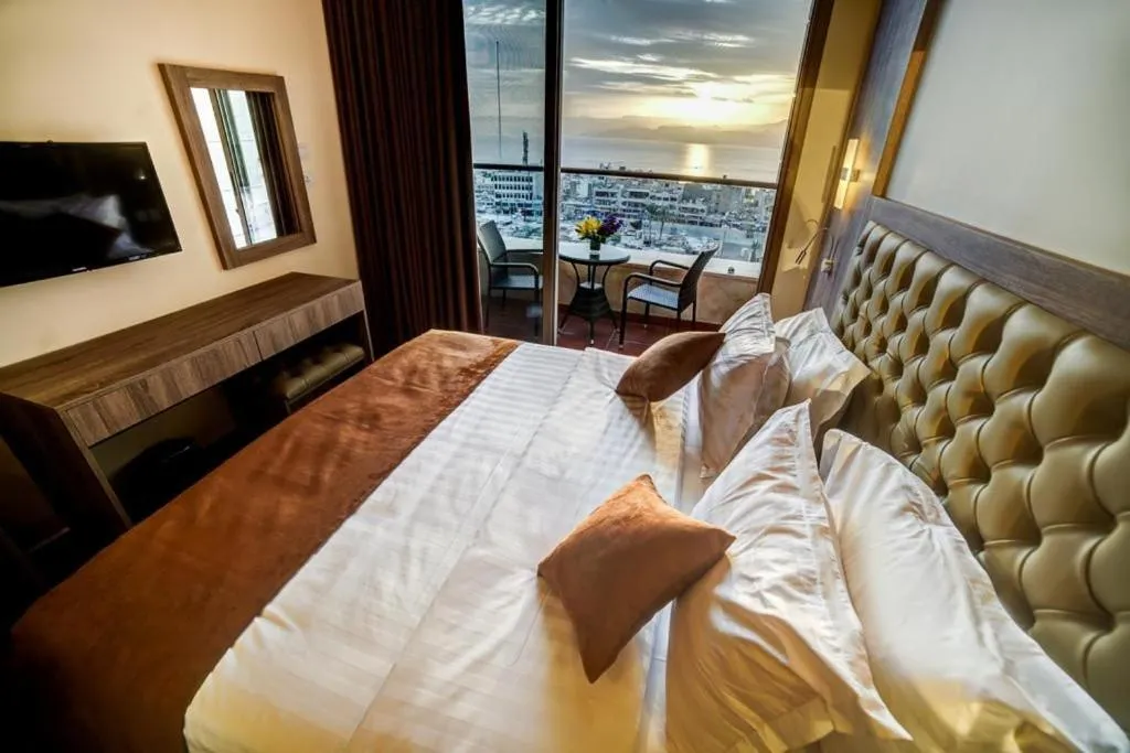 Bed in De-Lara hotel