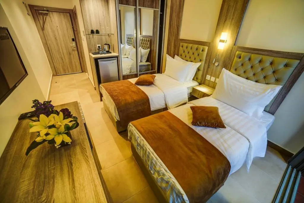 Bed in De-Lara hotel