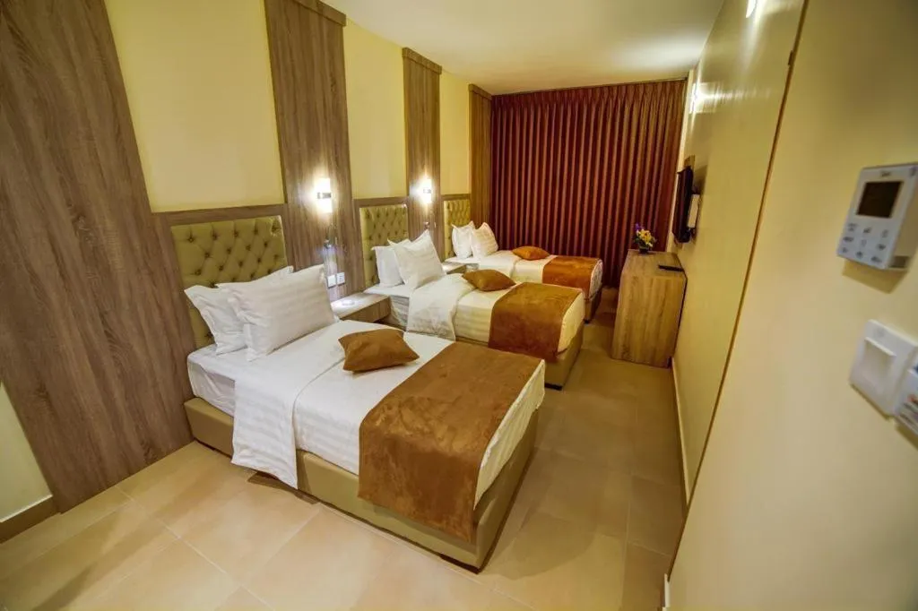 Bed in De-Lara hotel