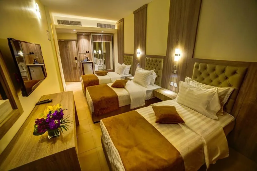 Bed in De-Lara hotel