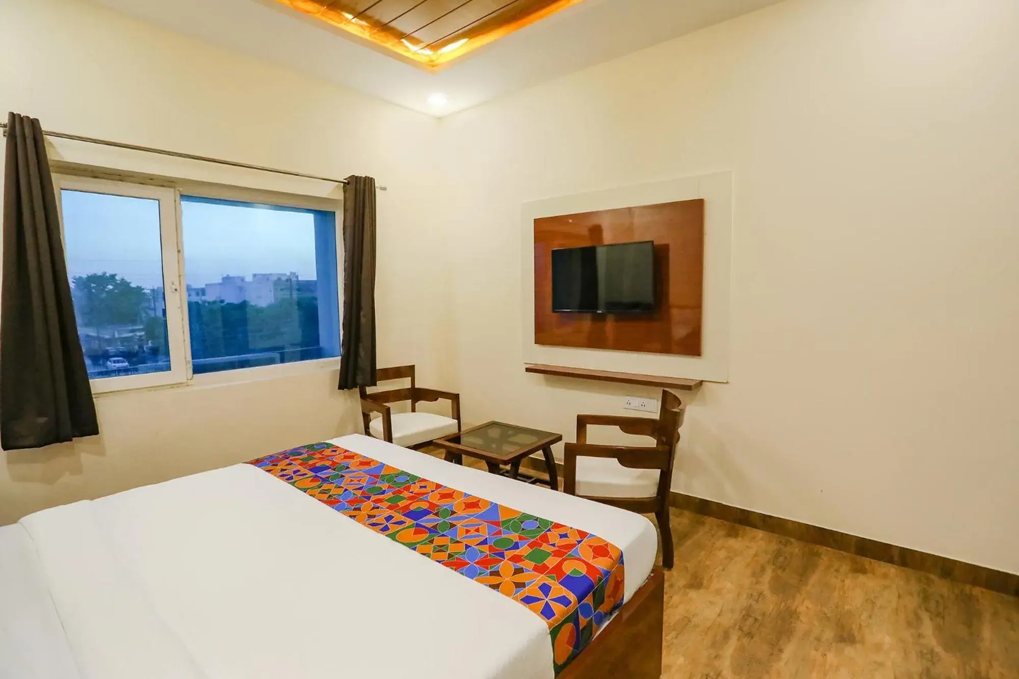 Communal lounge/ TV room, Bed in FabHotel Trijal Inn Communal lounge/ TV room, Bed in FabHotel Trijal Inn