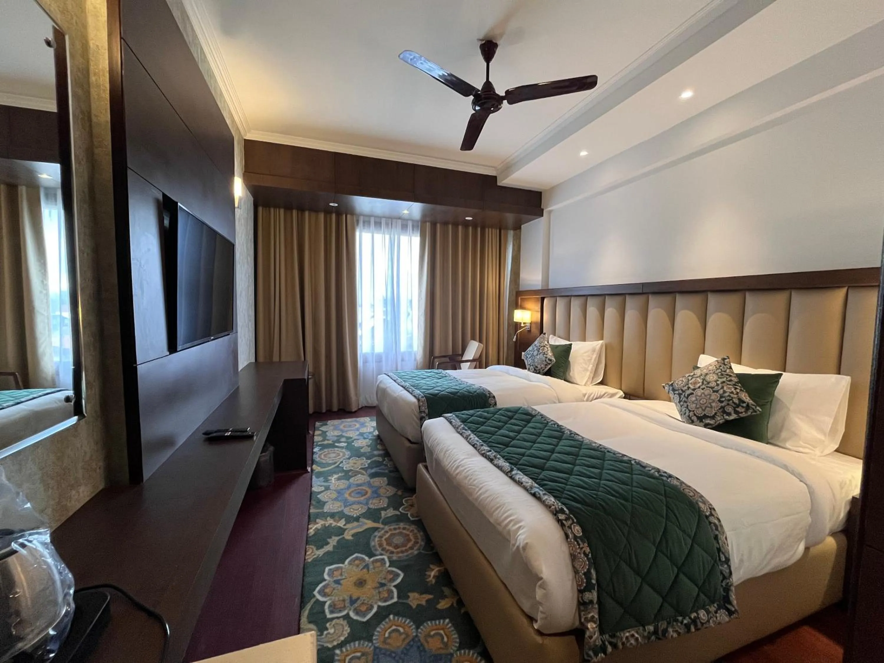 Bed in WelcomHeritage Grand, Srinagar