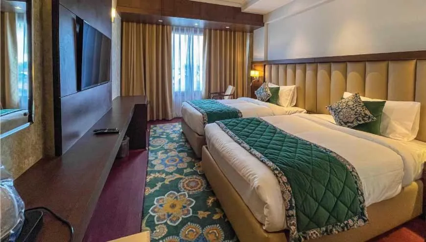 Bed in WelcomHeritage Grand, Srinagar