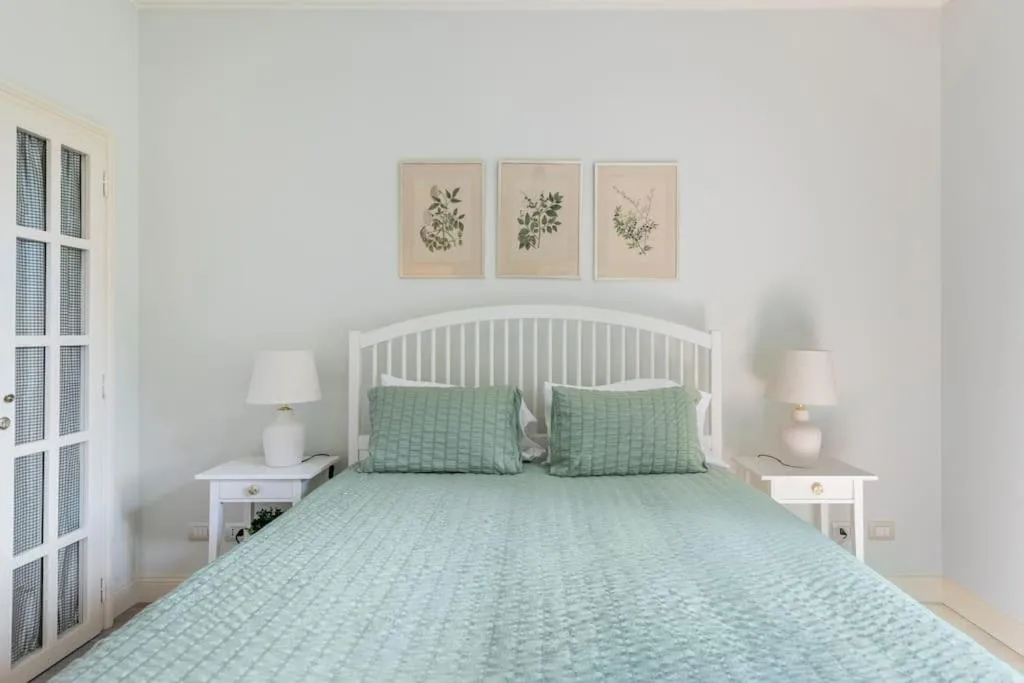 Bed in Il Giardino Garden View Apartment
