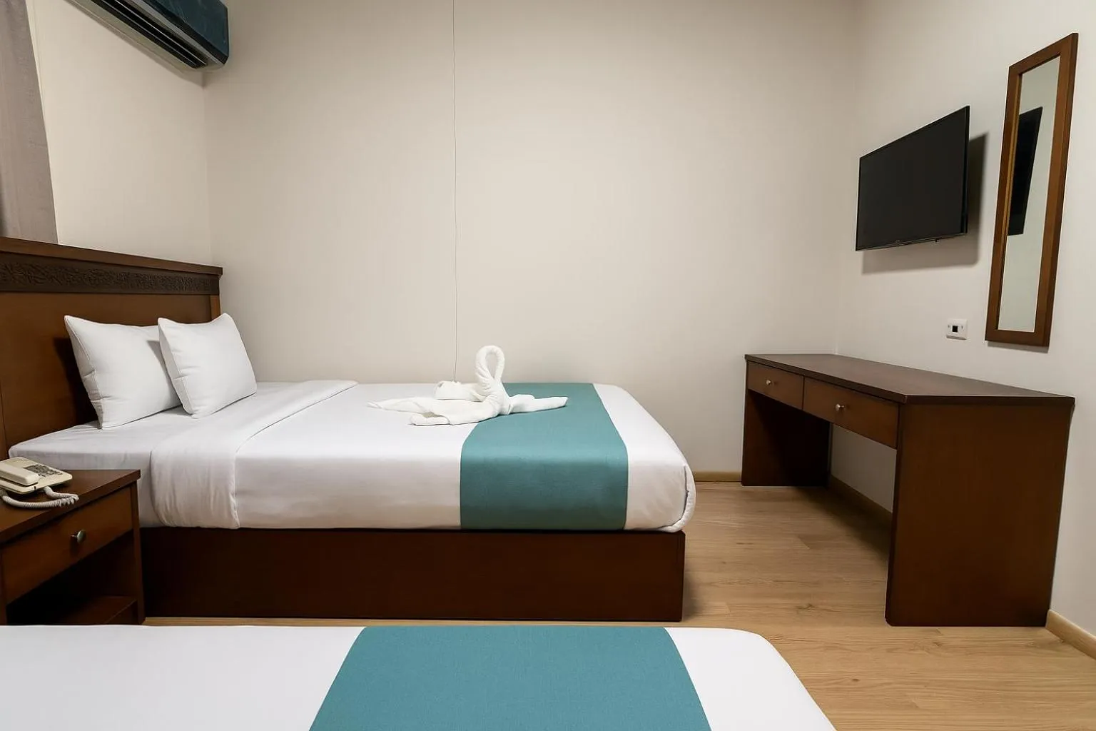 Bed in Miramar Evergreen Hotel