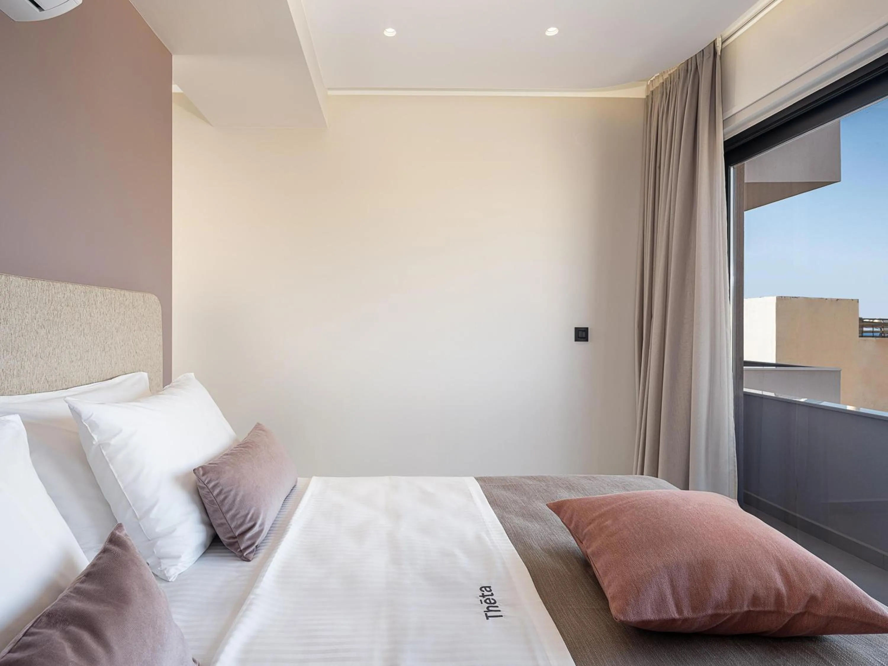 Bed in Theta Boutique Hotel