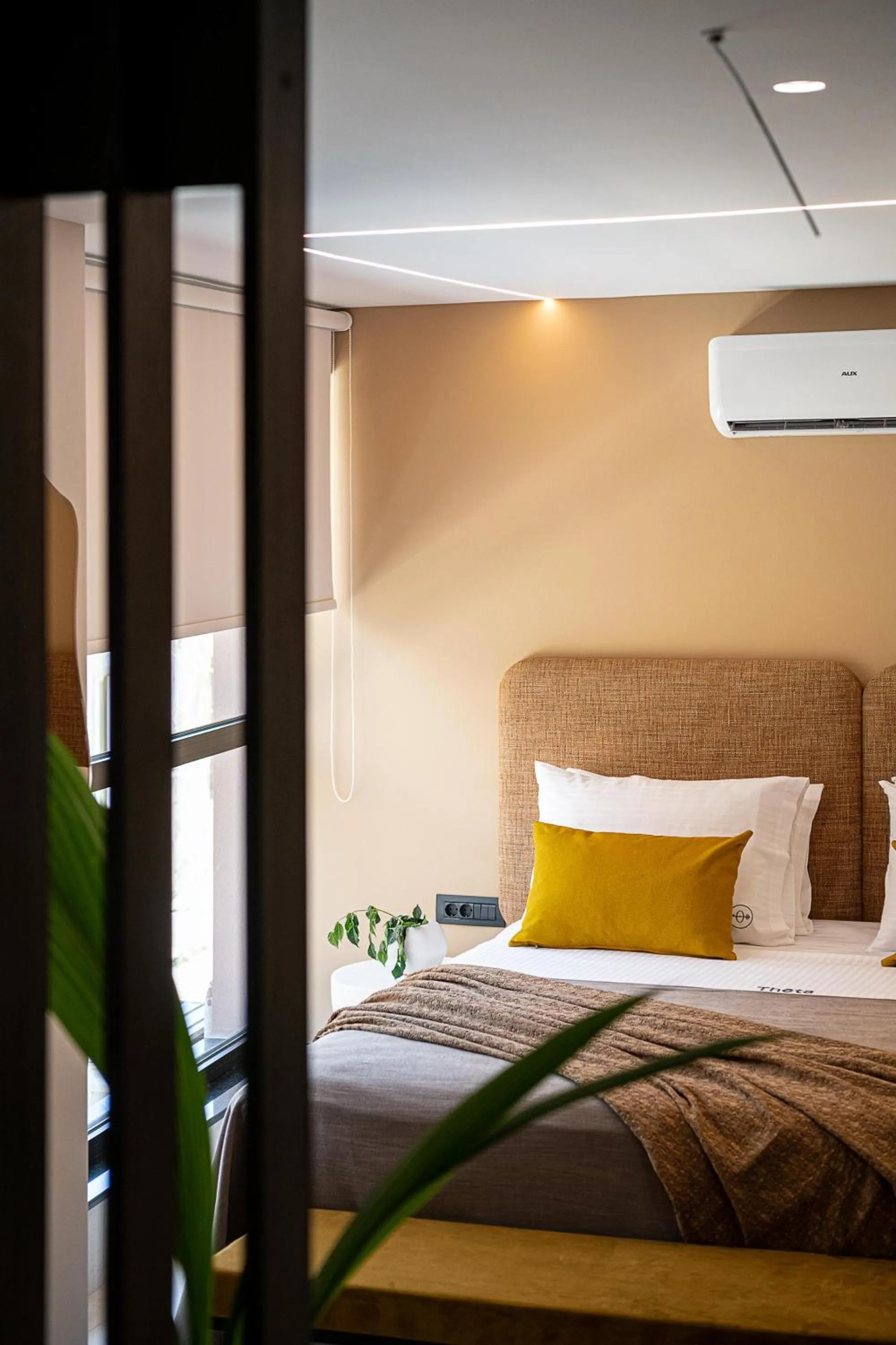 Bed in Theta Boutique Hotel