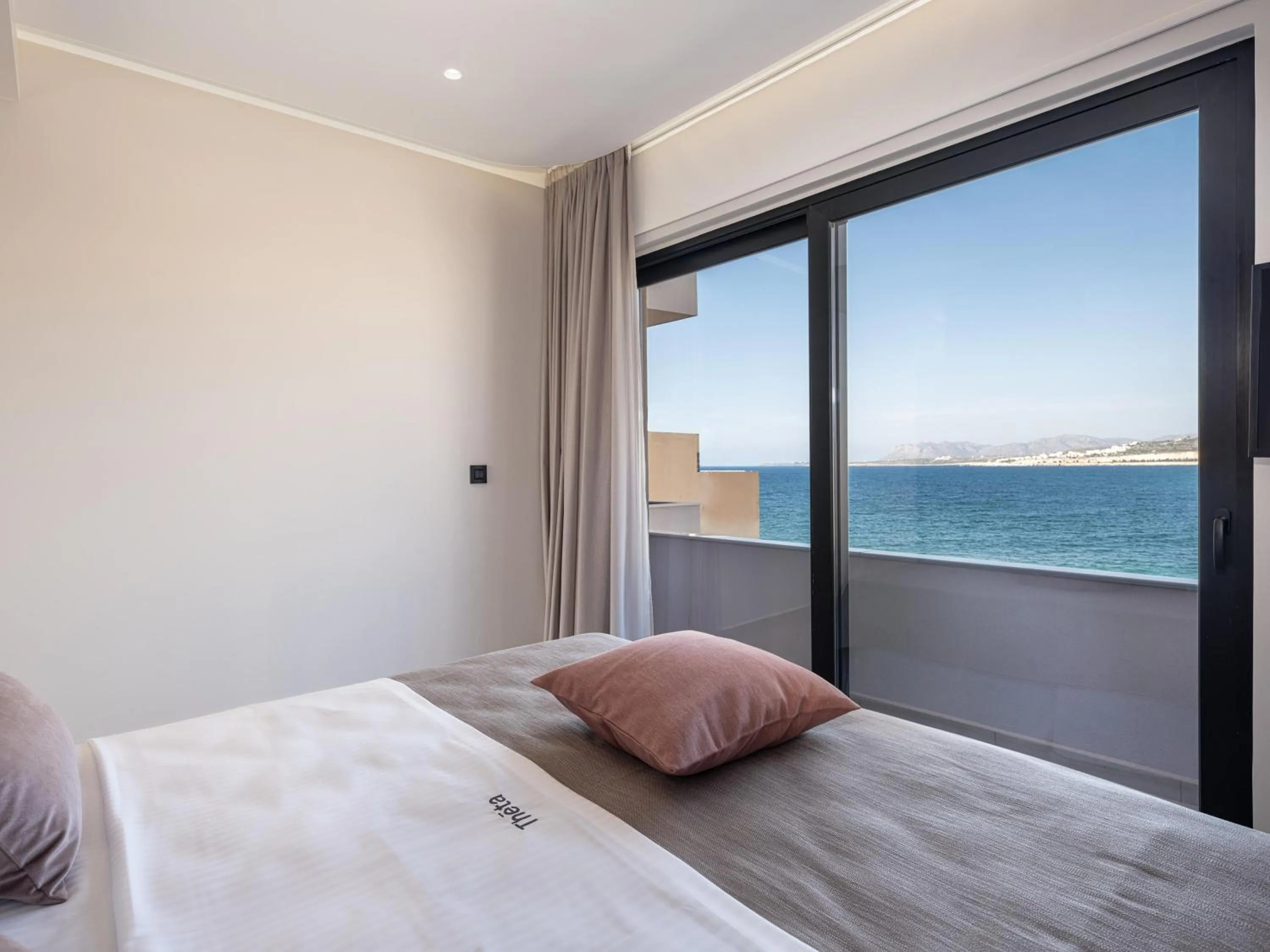 Bed in Theta Boutique Hotel