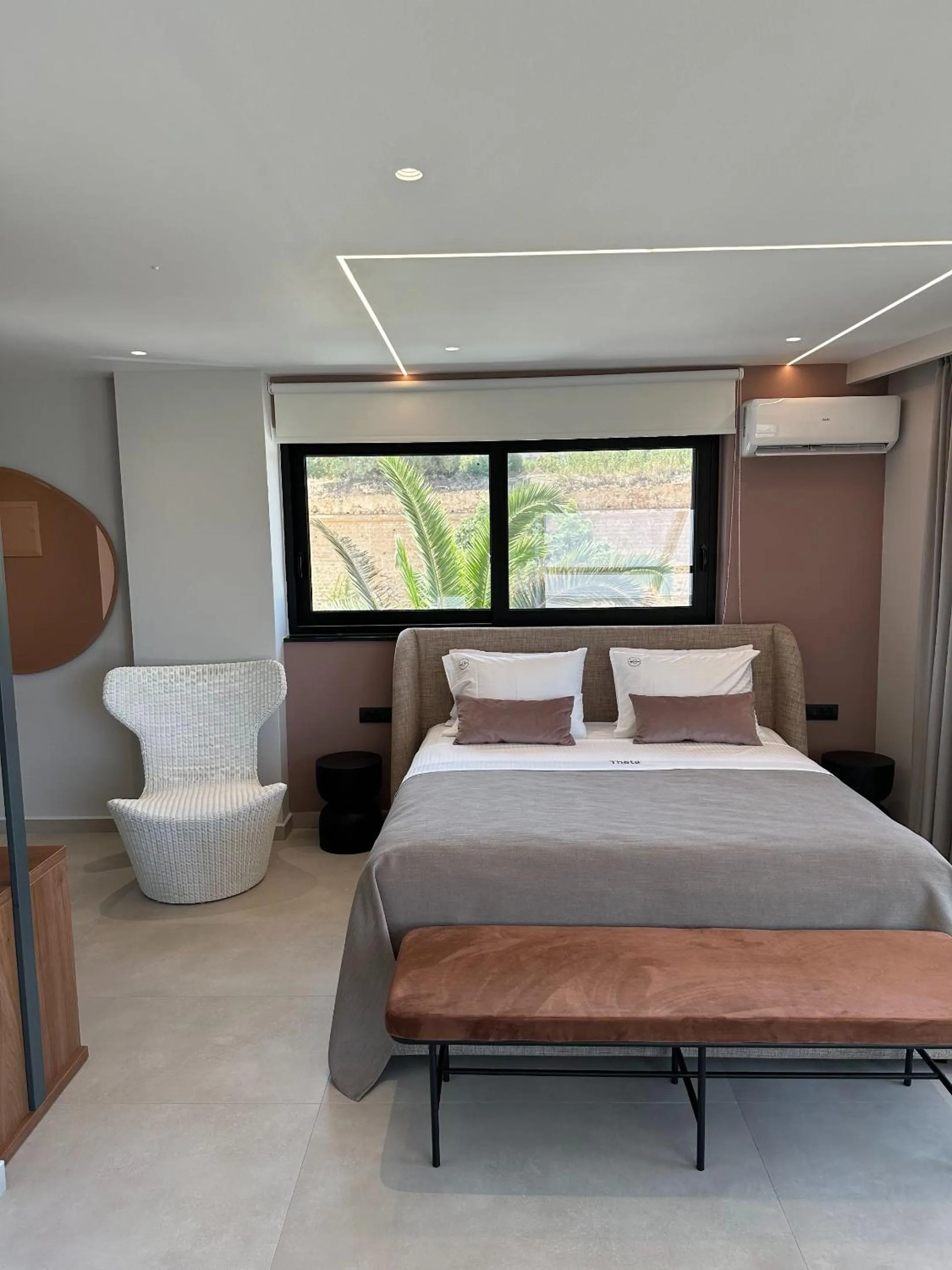 Bed in Theta Boutique Hotel