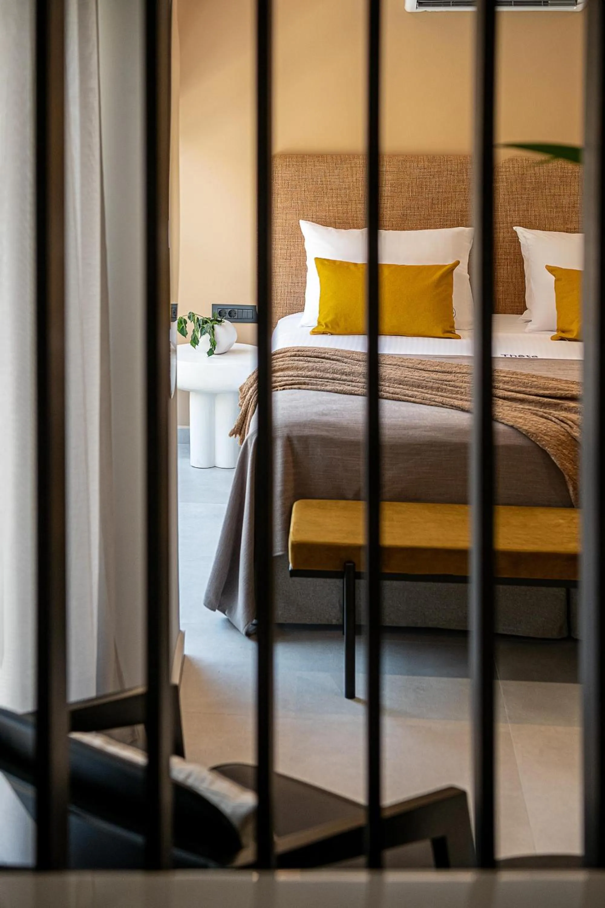 Bed in Theta Boutique Hotel